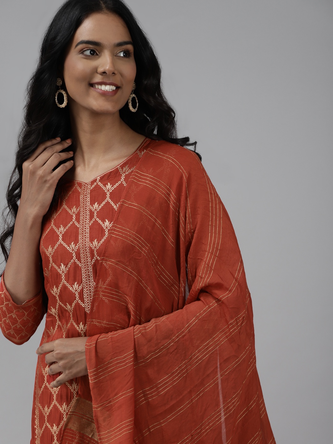 

Indo Era Women Rust Orange & Golden Ethnic Woven Design Kurta with Trousers & Dupatta