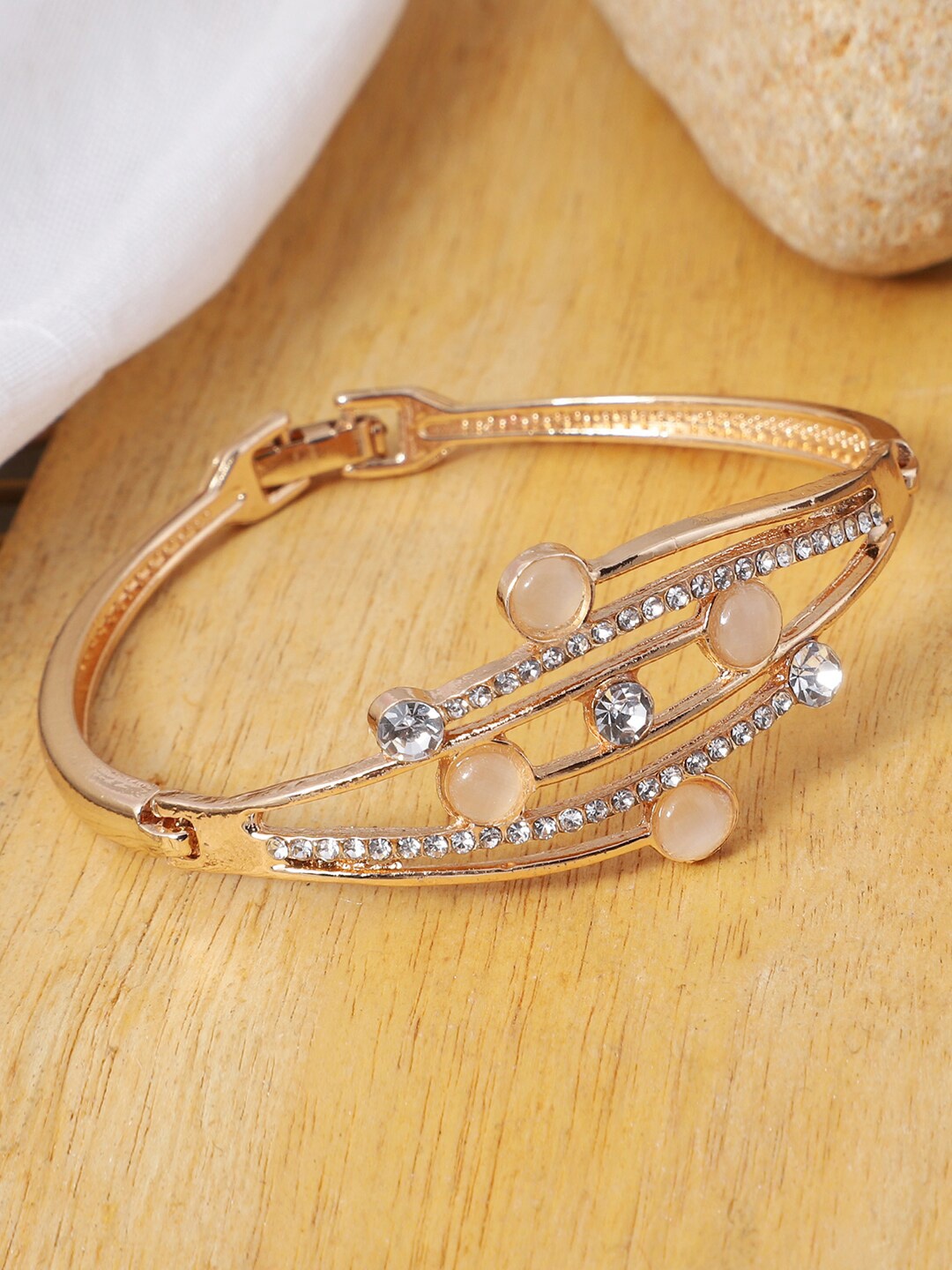 

ANIKAS CREATION Rose Gold-Plated Stone Studded Brass Handcrafted Bangle-Style Bracelet