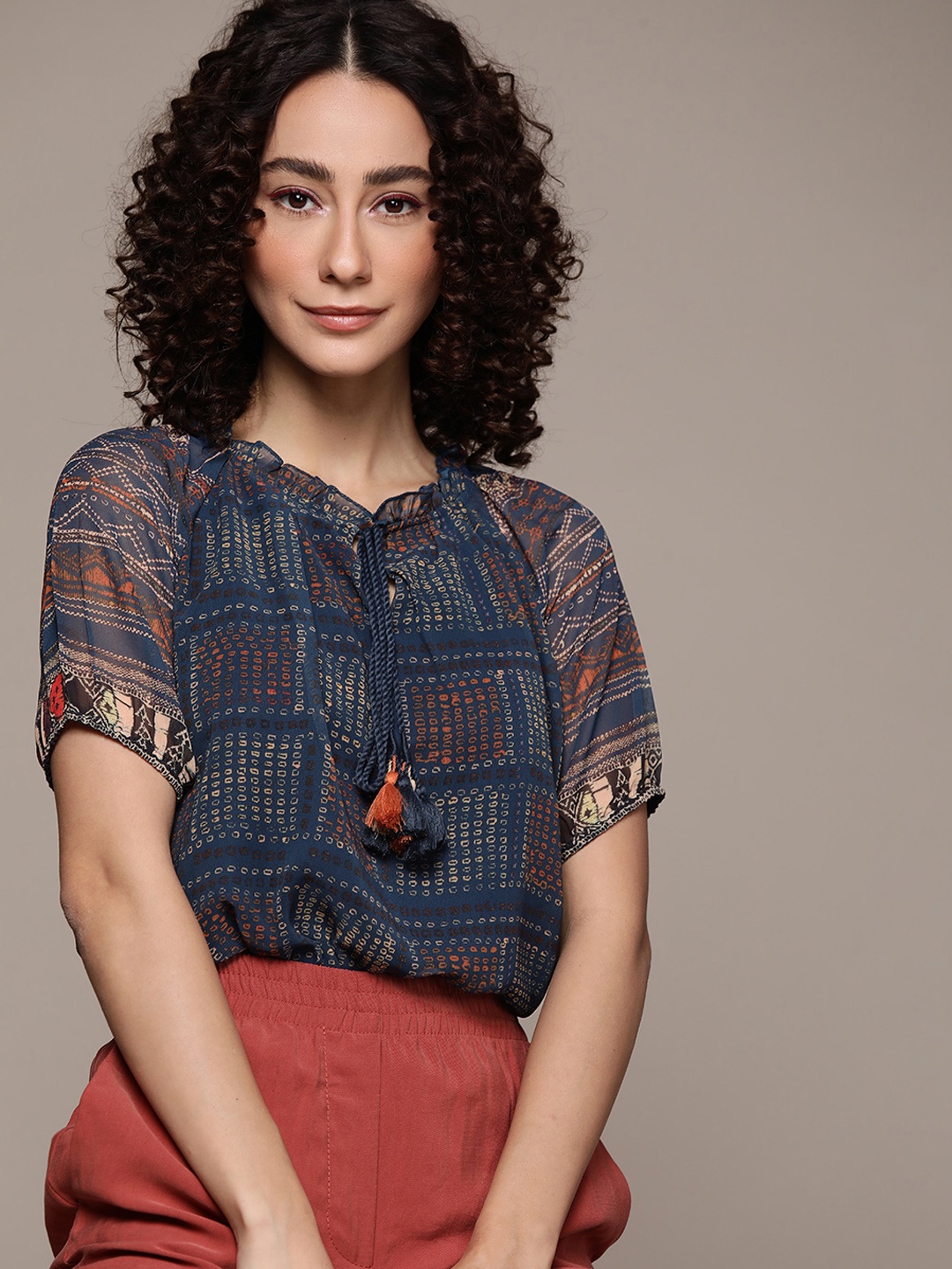

aarke Ritu Kumar Blue Tie-Up Neck Georgette Blouson Top