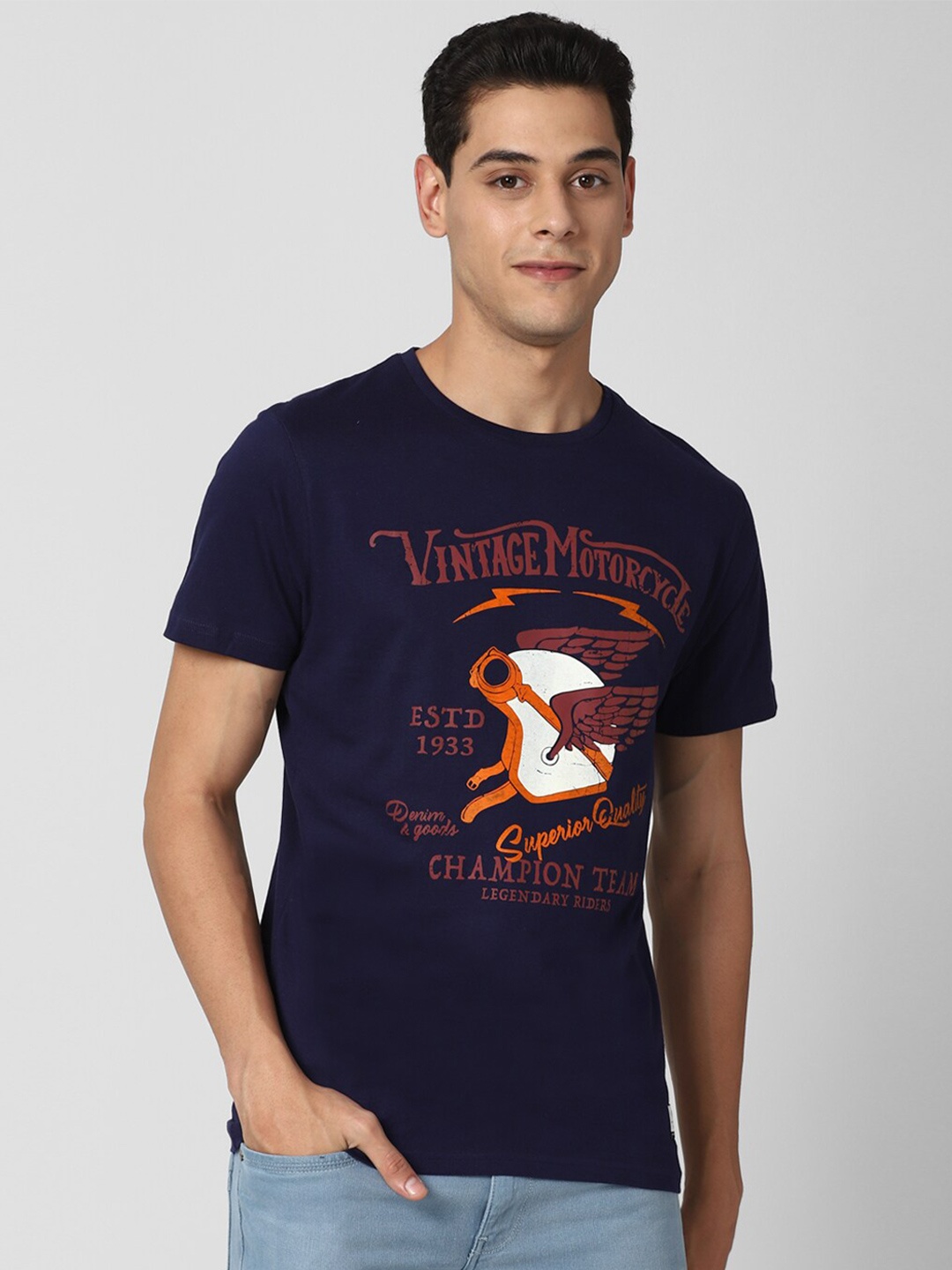 

Peter England Casuals Men Navy Blue Orange Typography Printed Pure Cotton T-shirt