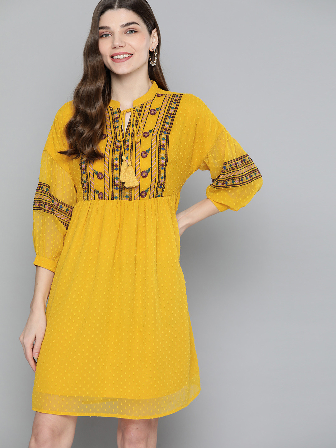 

Mast & Harbour Women Mustard Yellow Embroidered Tie-Up Neck Dobby Weave A-Line Dress