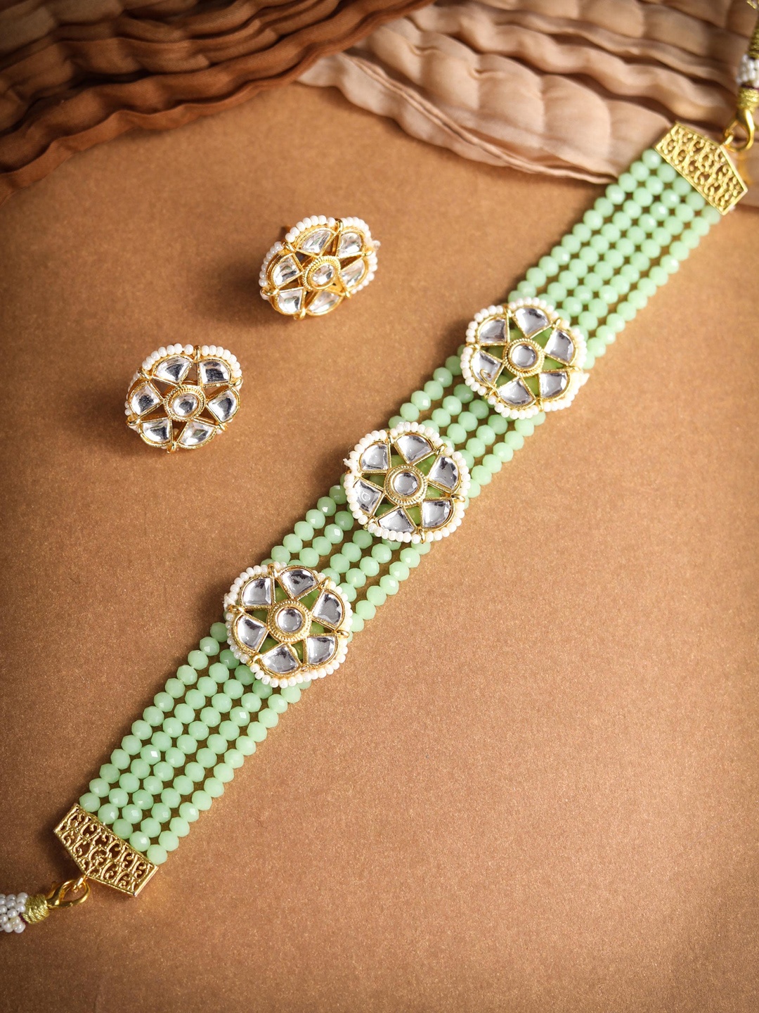 

Priyaasi Gold-Plated & Green Kundan Studded & Beaded Handcrafted Jewellery Set