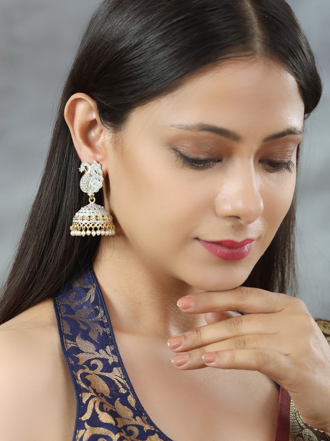 

Priyaasi Gold-Plated & White Beads Peacock Shaped Jhumkas Earrings