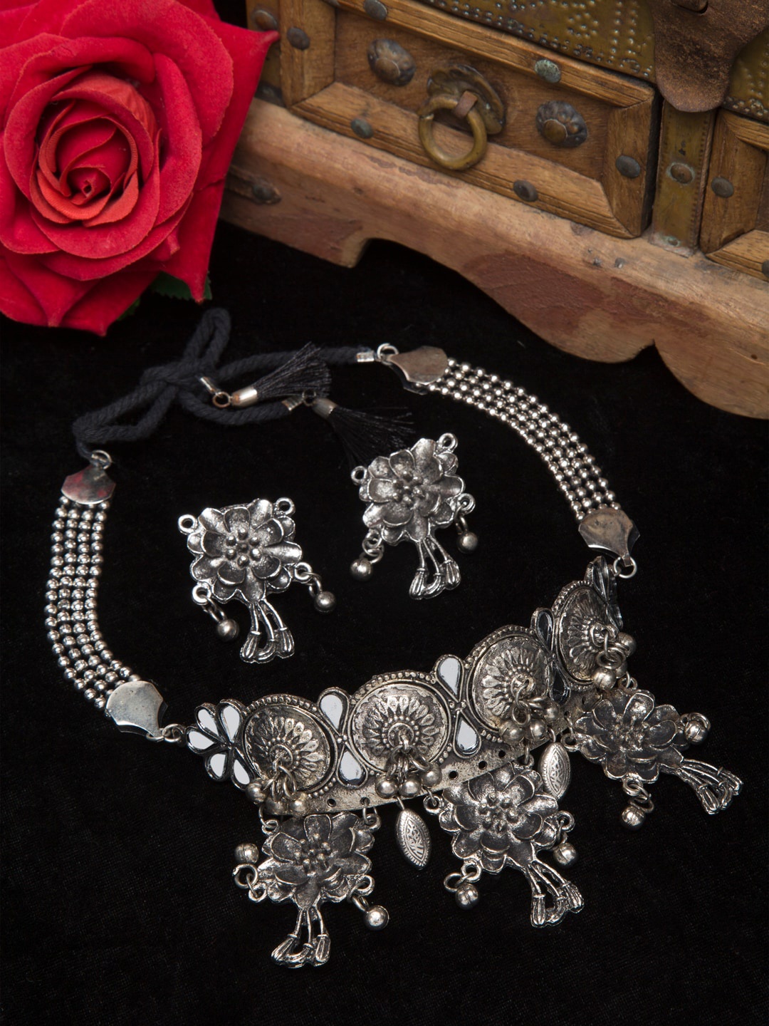 

Moedbuille Silver Mirror & Ghugroo Studded Floral Oxidised Handcrafted Jewellery Set