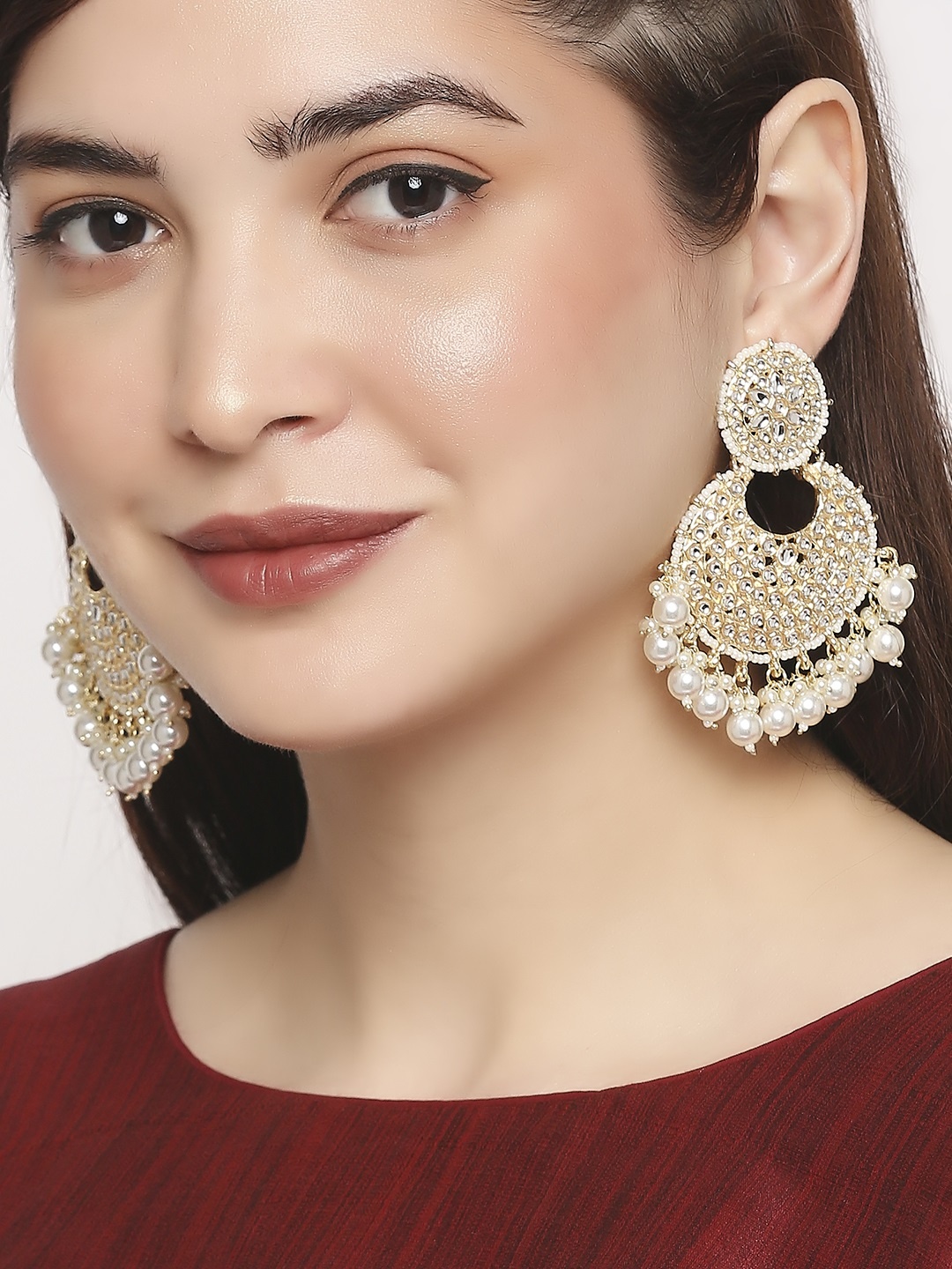 

OOMPH Gold-Toned & White Alloy Gold Plated Crescent Shaped Chandbalis