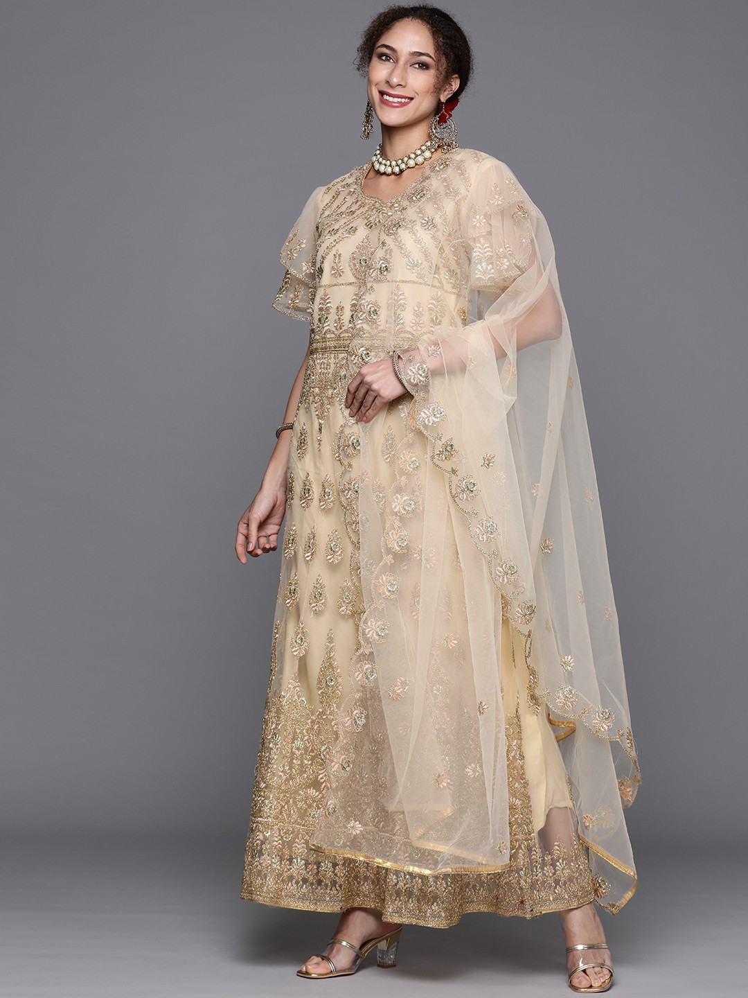 

Chhabra 555 Cream & Gold Embroidered Semi-Stitched Zari Gown & Dupatta