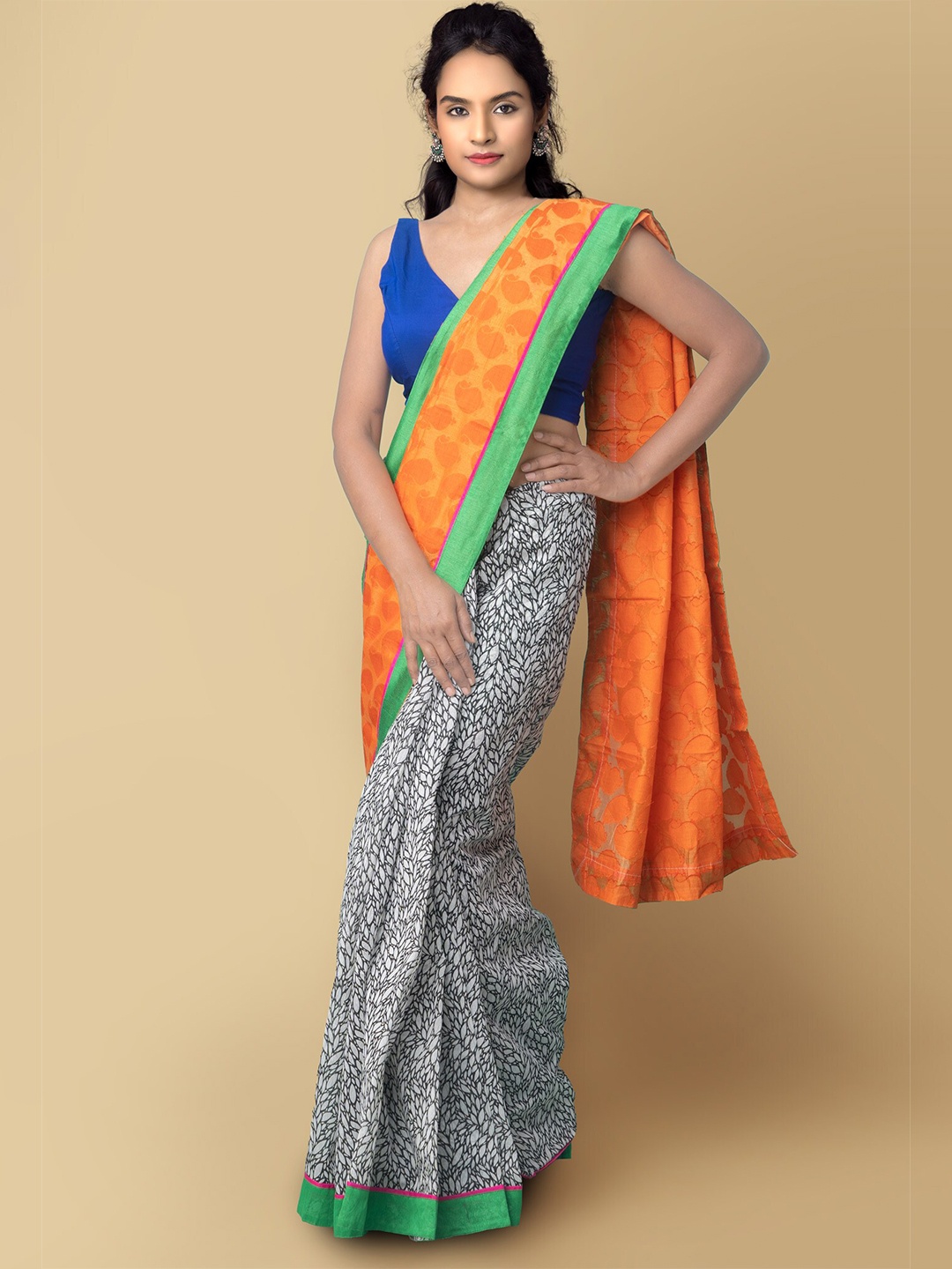 

Unnati Silks White & Orange Floral Silk Cotton Banarasi Saree