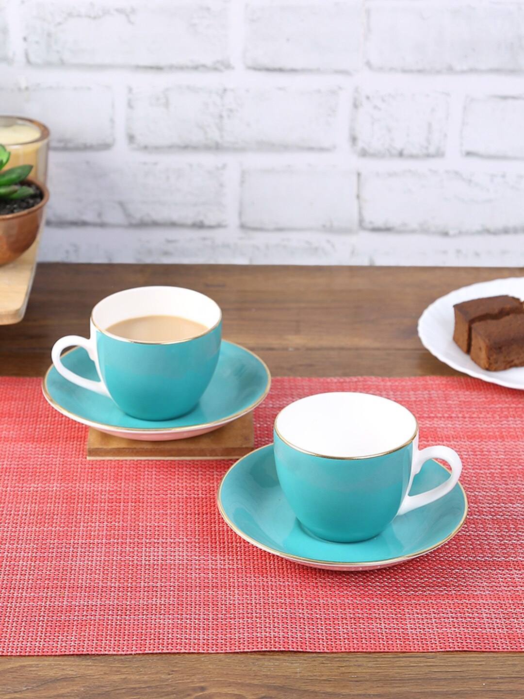 

HomeTown Teal & White Solid Ceramic Glossy Cups and Saucers Set of Cups and Mugs