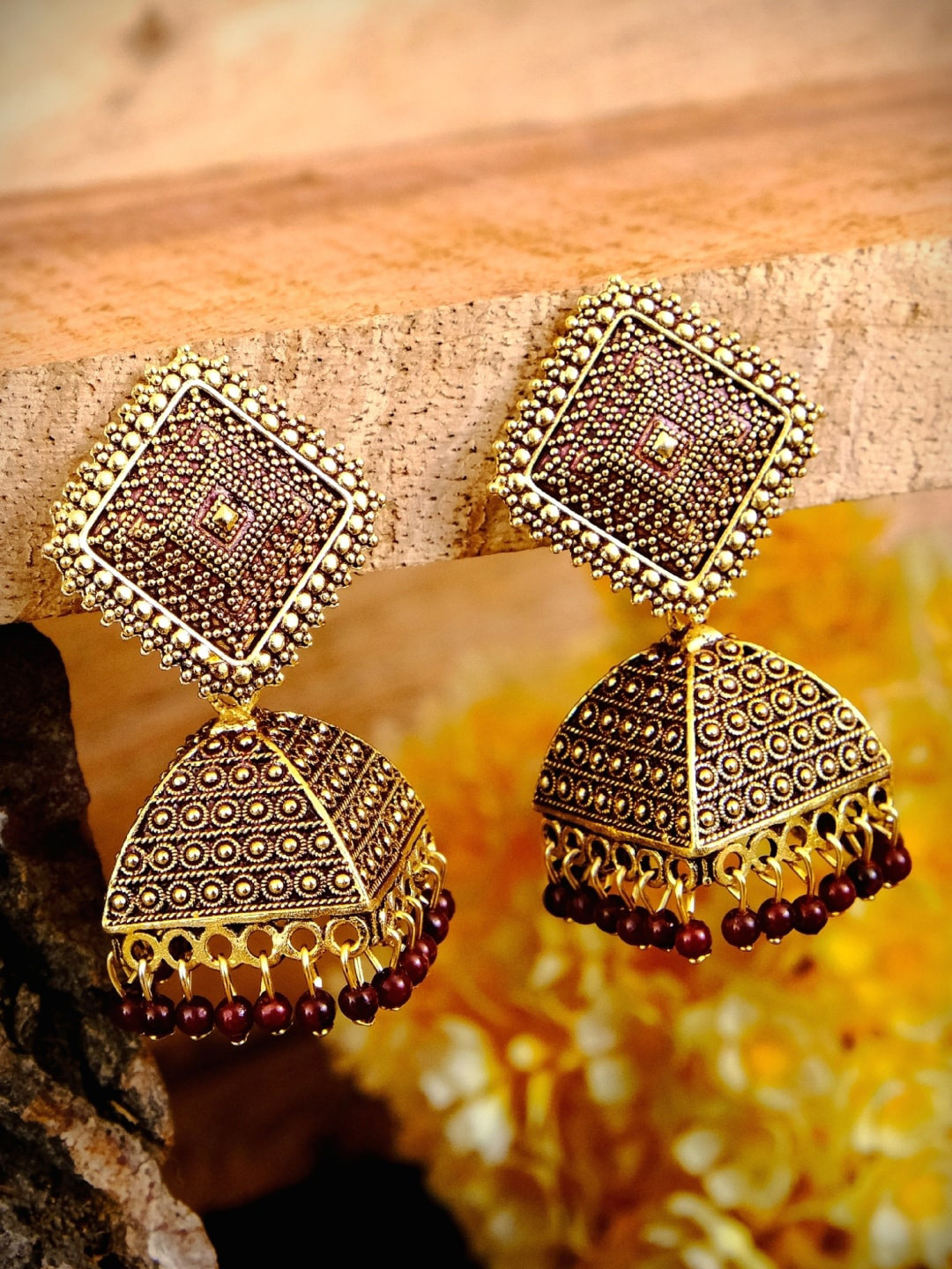 

Crunchy Fashion Maroon & Gold-Toned Classic Jhumkas Earrings