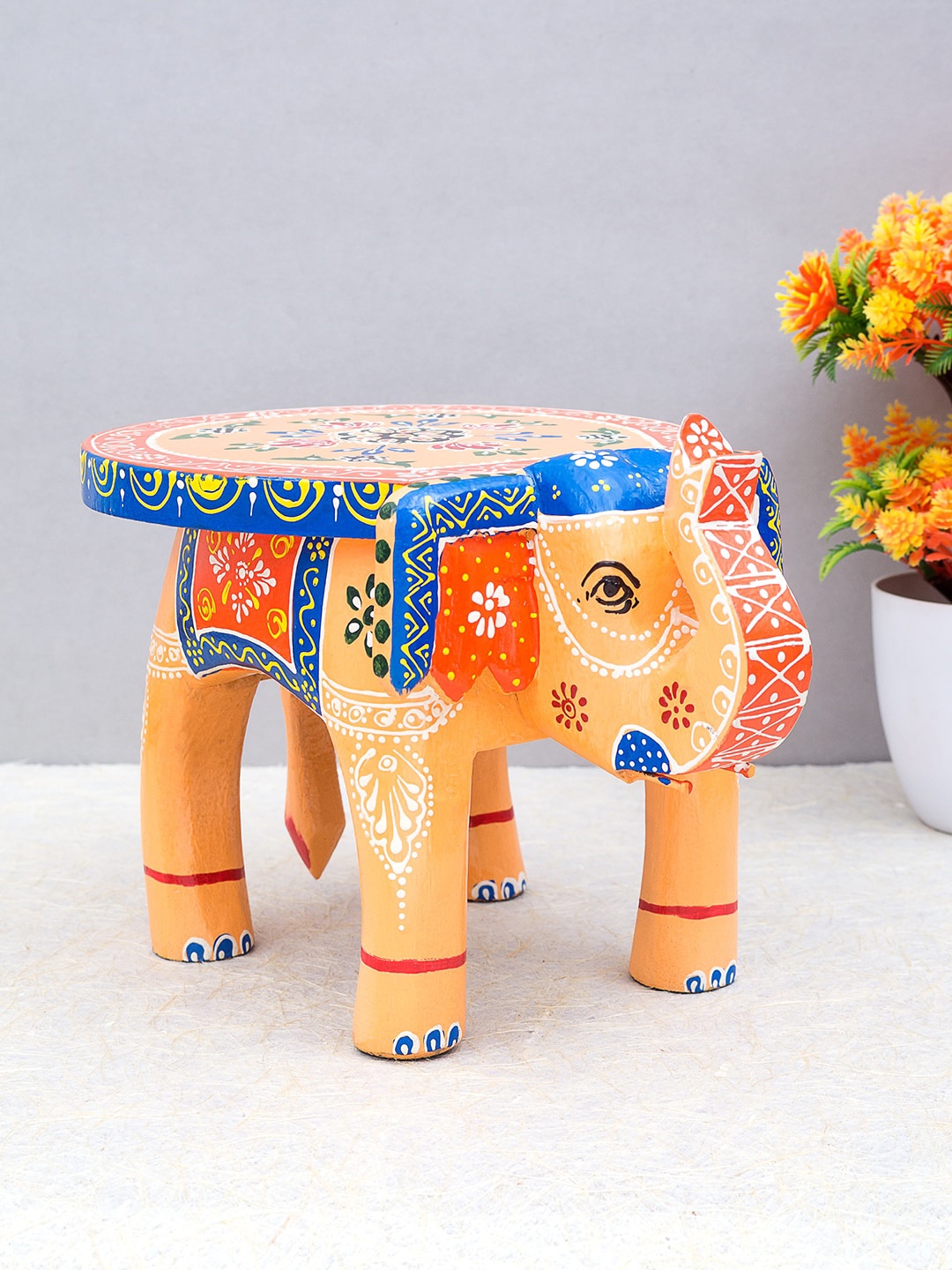 

Golden Peacock Beige & Blue Painted Handcrafted Wooden Elephant Stool Showpiece