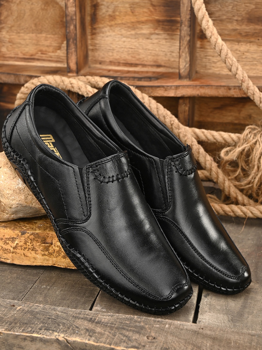 

Mactree Men Black Solid Leather Formal Slip-Ons