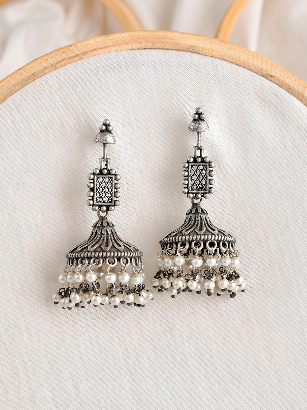 

Infuzze Silver-Toned & Plated Contemporary Pearls Oxidised Jhumkas Earrings