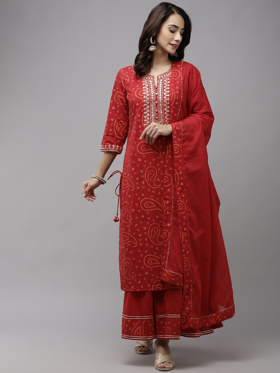 

Ishin Women Red Bandhani Embroidered Regular Aari Work Pure Cotton Kurta with Sharara & With Dupatta