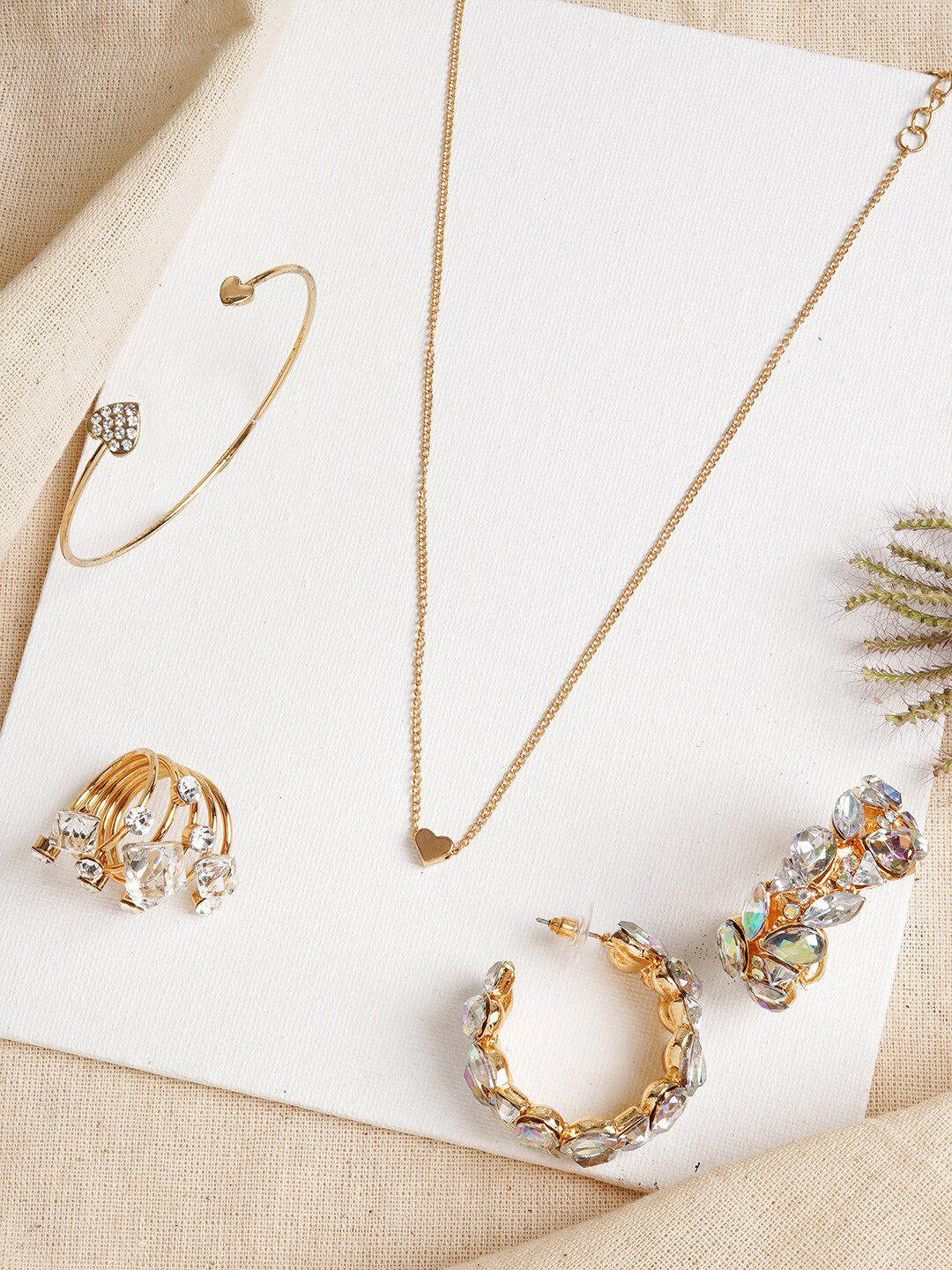

JOKER & WITCH Women Gold-Plated & White Stone-Studded Jewellery Set