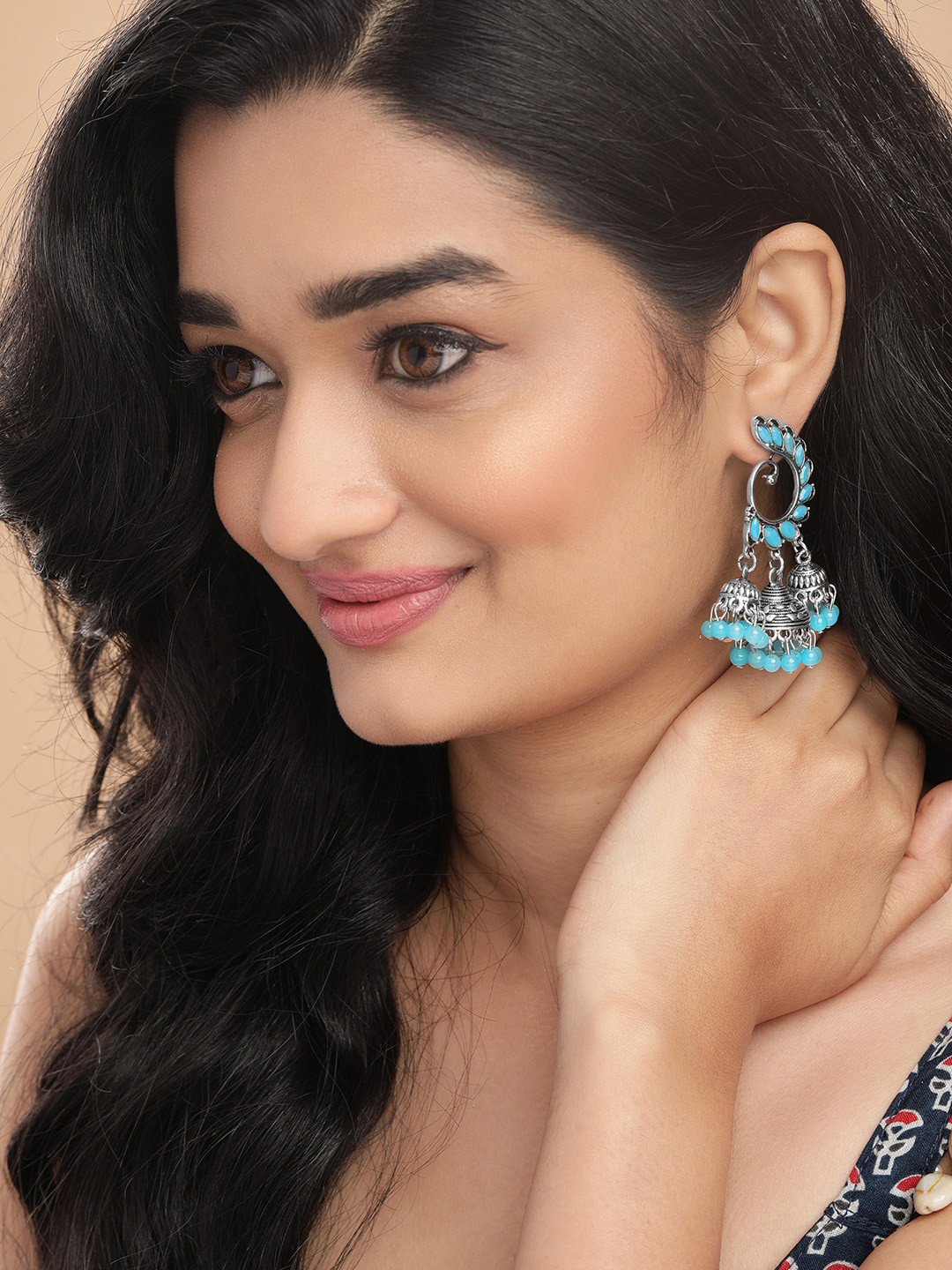 

Anouk Silver-Toned & Turquoise Blue Peacock Wing Jhumka Earrings