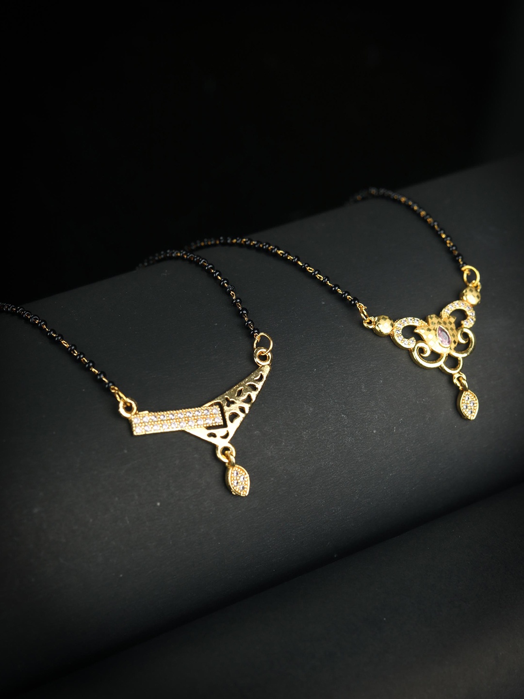 

Priyaasi Set Of 2 White & Black Gold-Plated AD-Studded & Beaded Mangalsutra