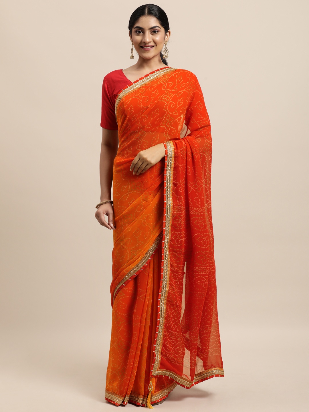 

Triveni Orange Bandhani Pure Georgette Bandhani Saree