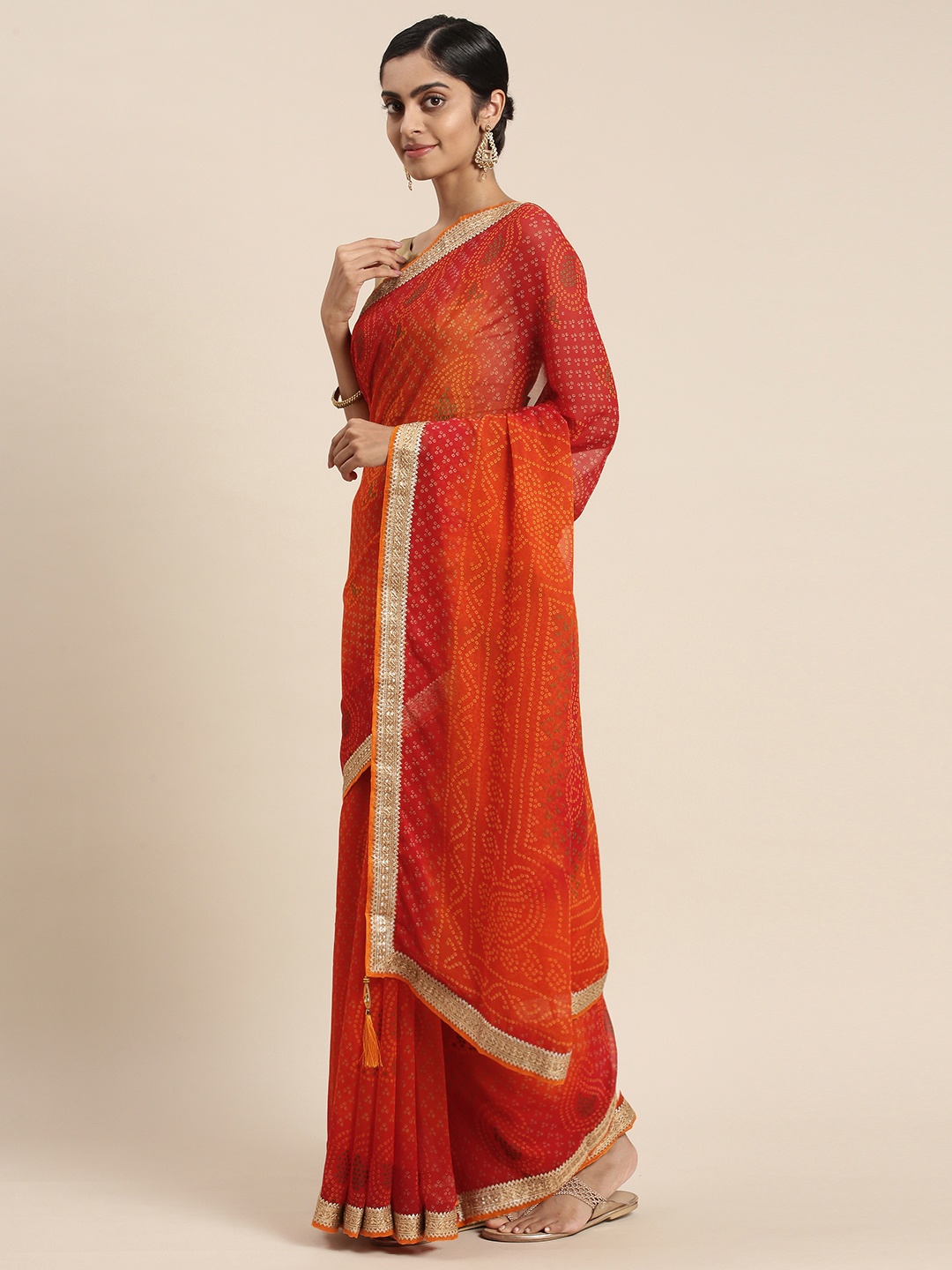 

Triveni Orange Bandhani Zari Pure Georgette Bandhani Saree