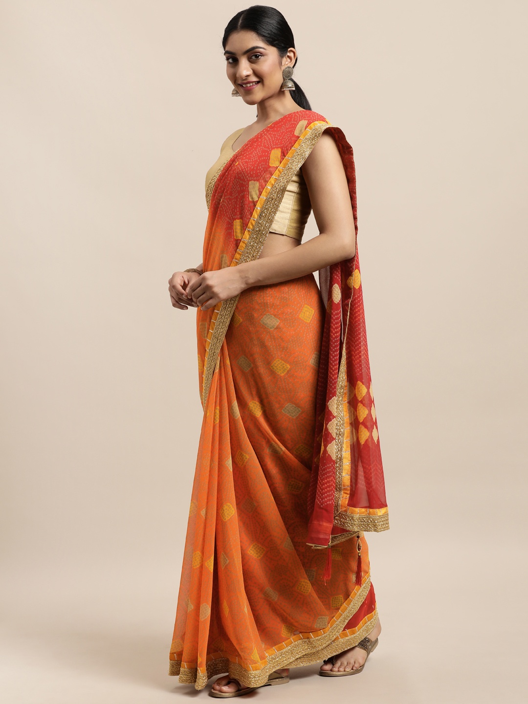 

Triveni Orange Bandhani Zari Pure Georgette Bandhani Saree