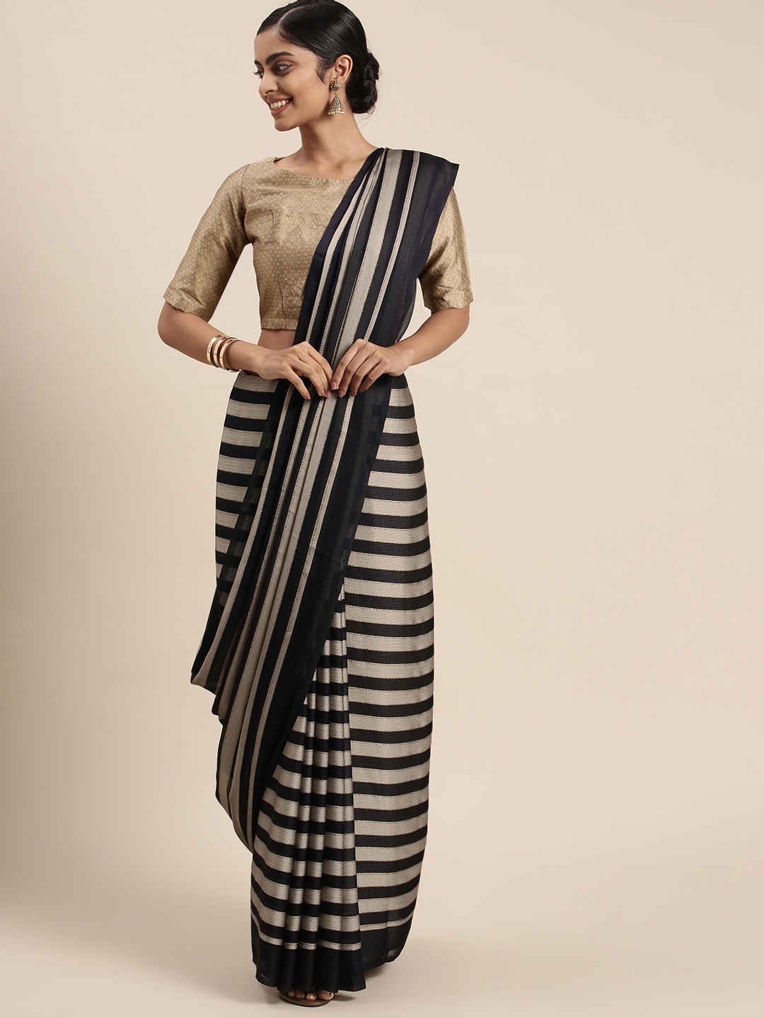 

Triveni Grey & Navy Blue Striped Pure Chiffon Saree