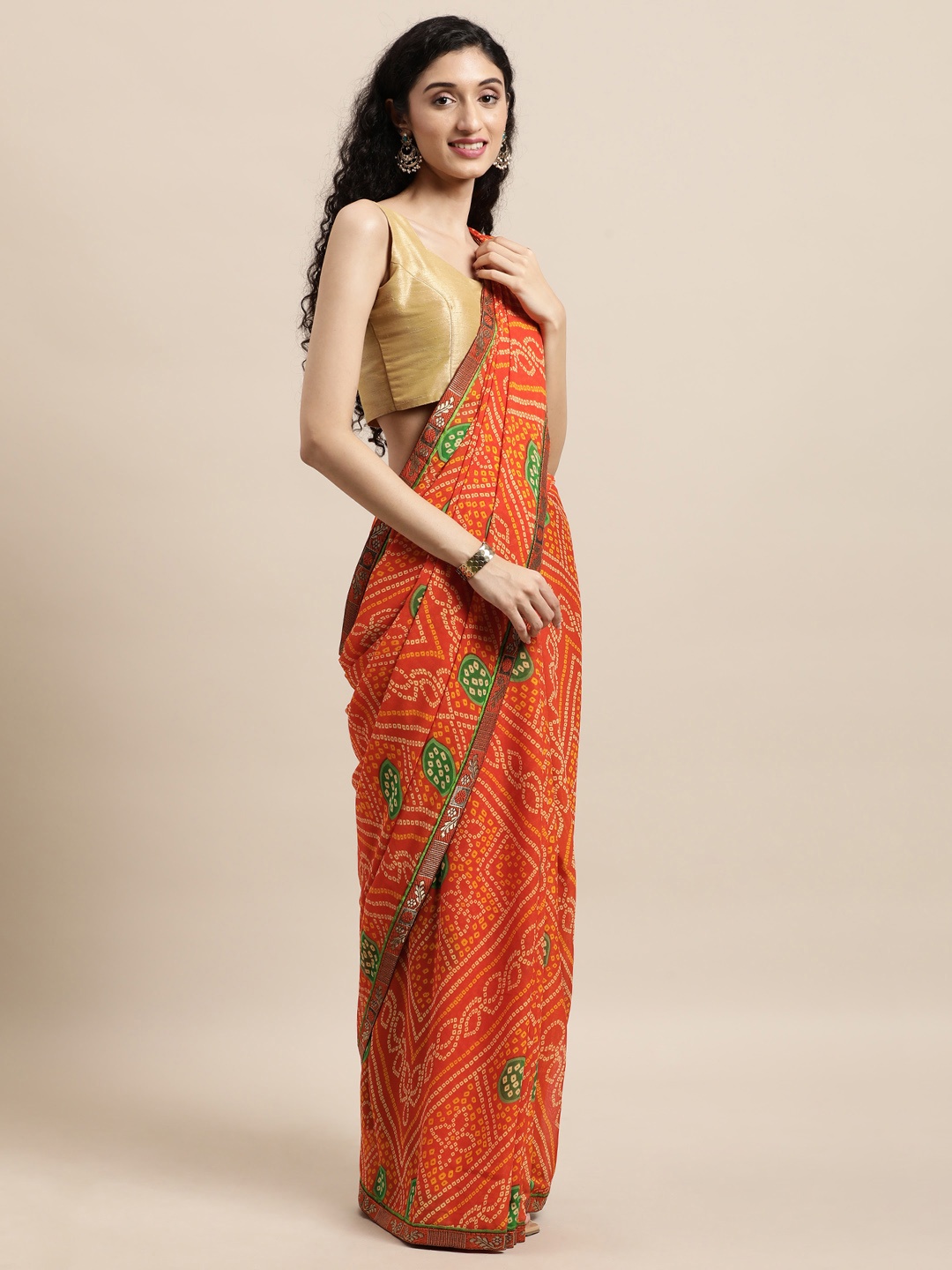 

Triveni Orange Bandhani Pure Georgette Bandhani Saree