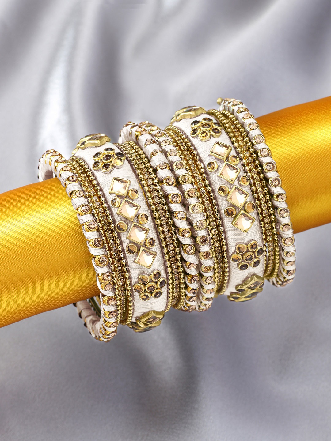 

Peora Set of 10 White Gold-Plated Silk Thread Handcrafted Chuda Bangle Set