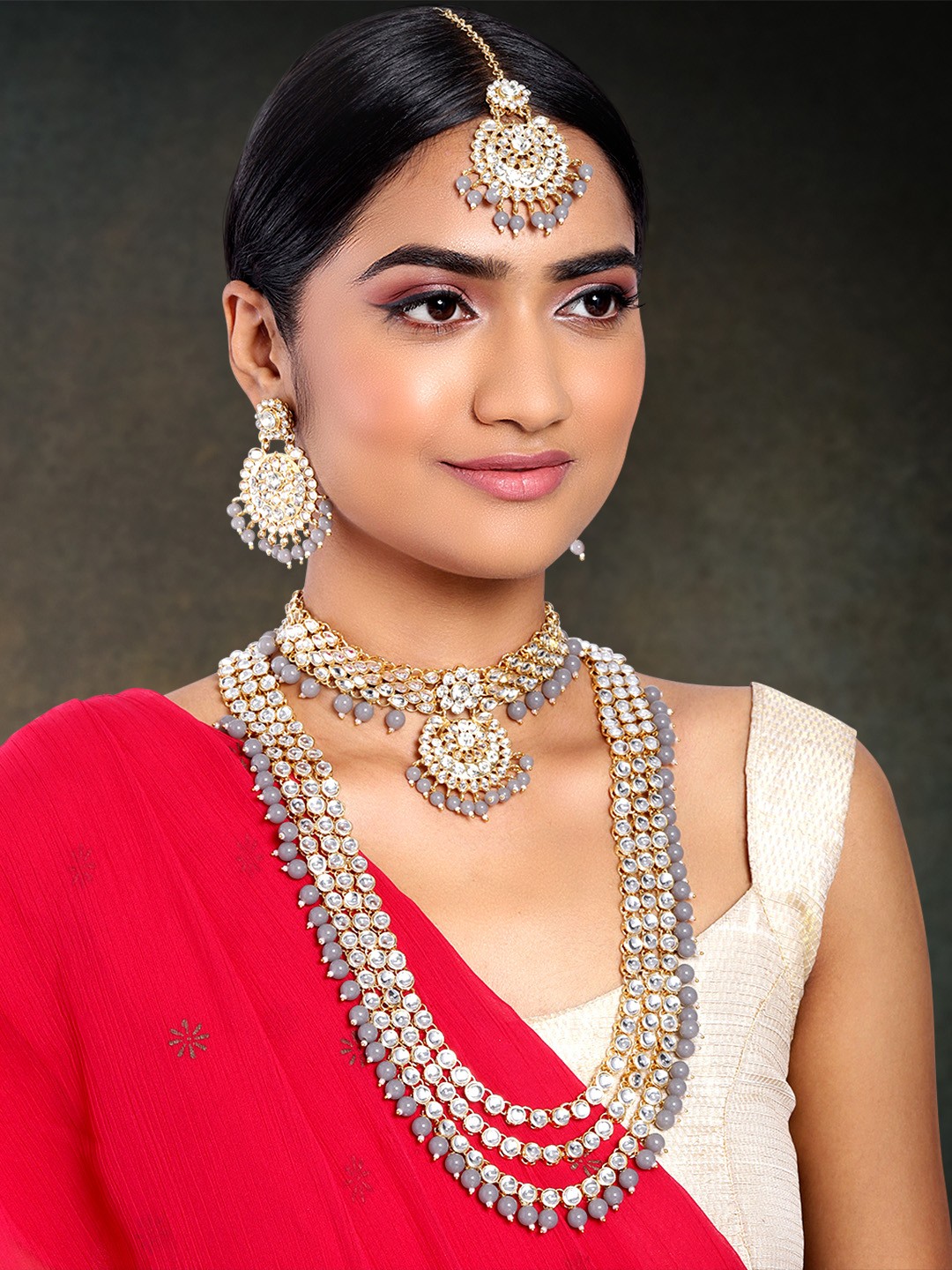 

Peora Women Grey & 18K Gold-Plated Kundan Bridal Necklace Jewellery Set
