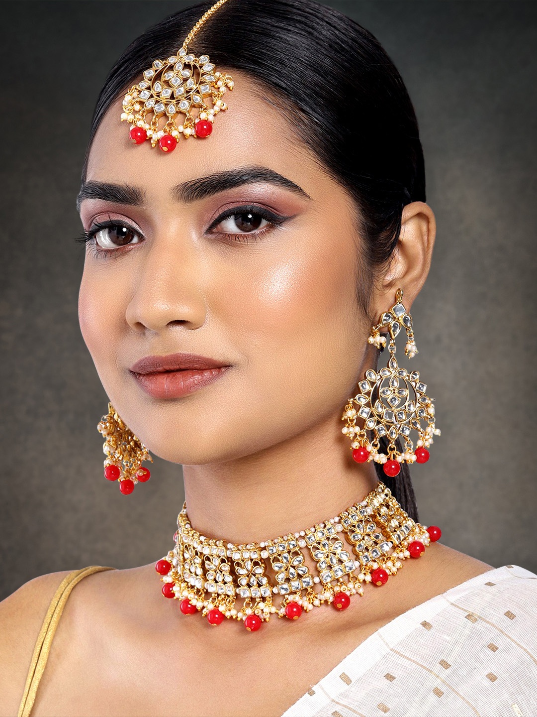 

Peora Red & White Gold-Plated Kundan Embellished Handcrafted Jewellery Set