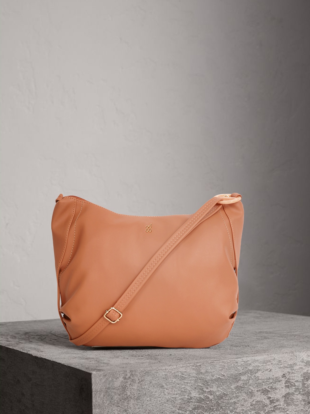 

Baggit Beige Solid Sling Bag