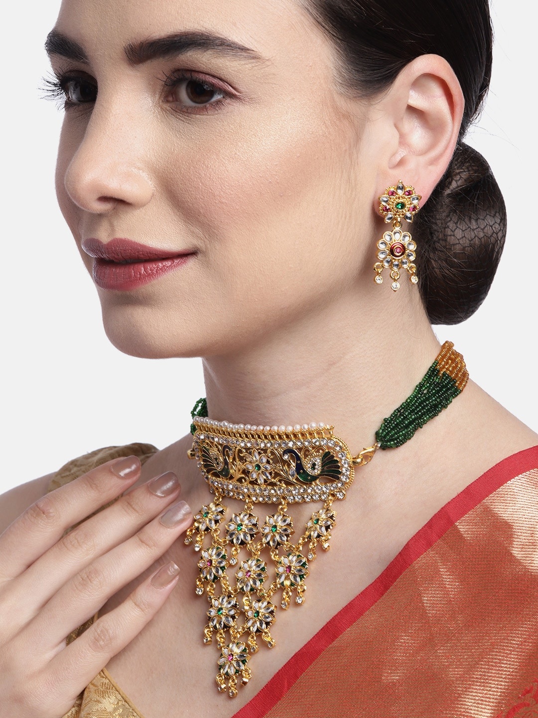 

Anouk Green Gold-Plated Stone-Studded & Beaded Rajputana Jewellery Set