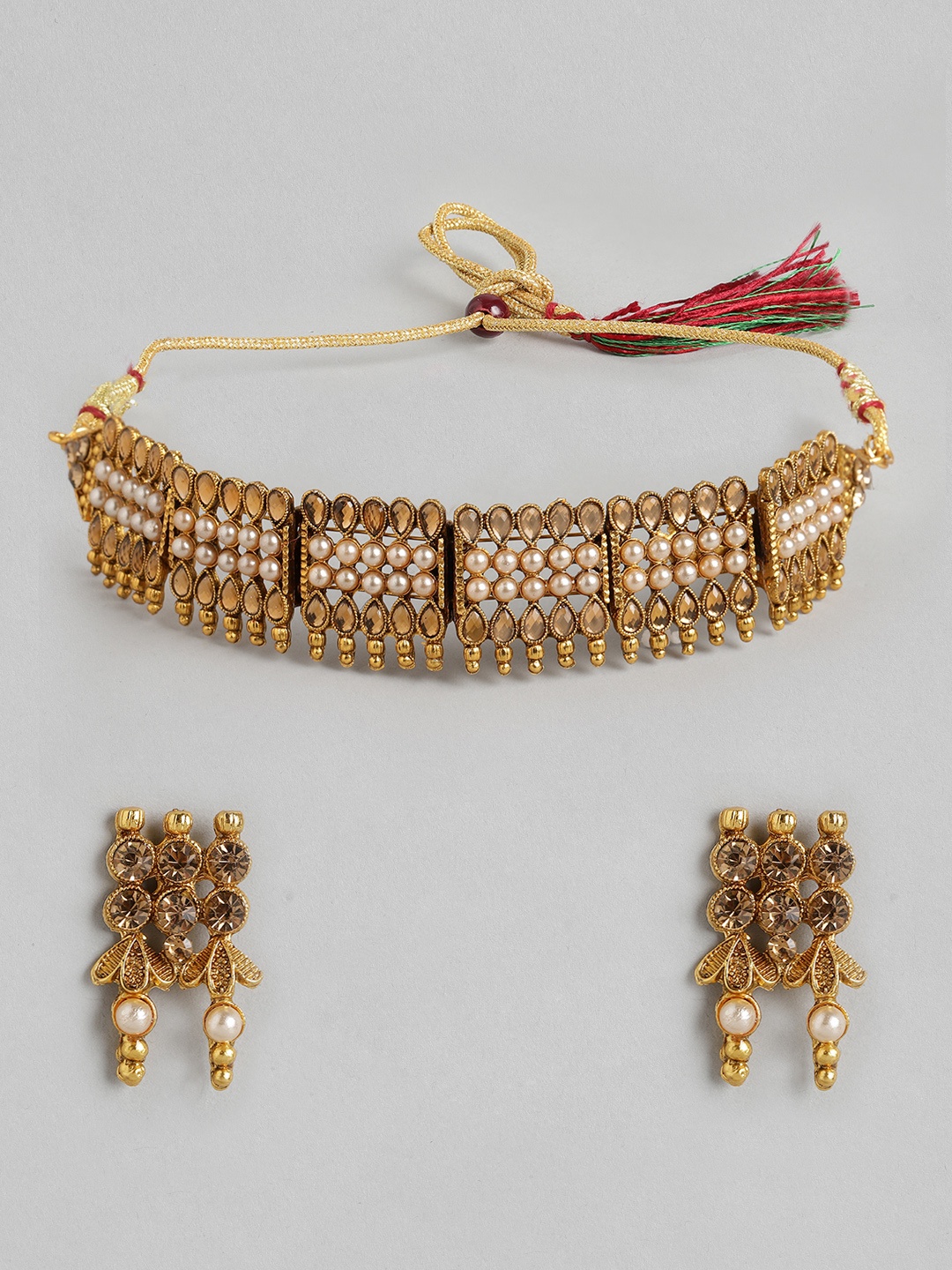 

Anouk Women Gold-Plated & Off-White Stone Studded & Beaded Choker Jewellery Set