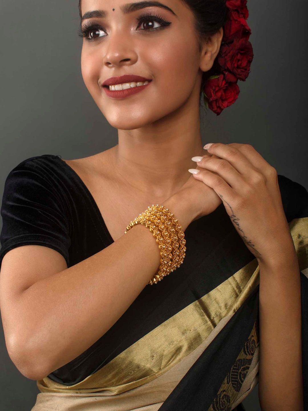 

Fida Set Of 4 Gold Toned White Pearl Studded Bangles