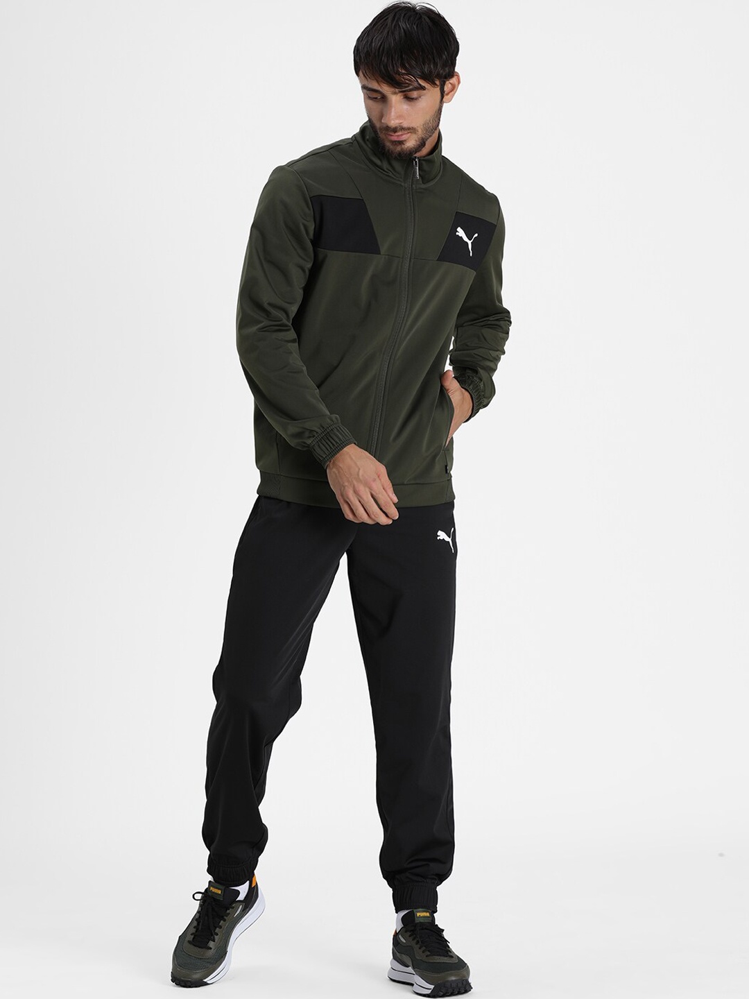 

Puma Men Olive Green Solid Sports Tracksuits