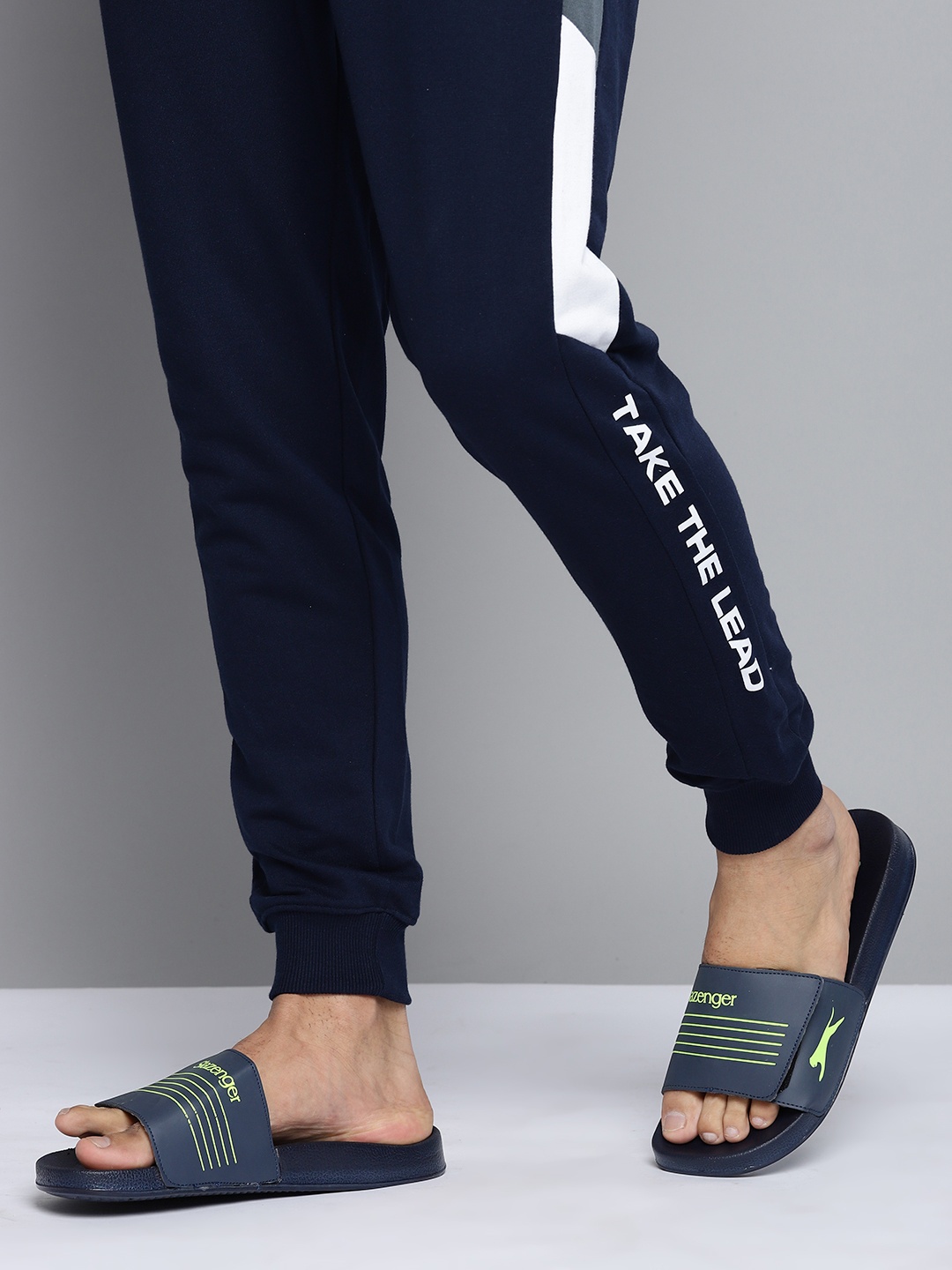 

Slazenger Men Navy Blue & Fluorescent Green Striped & Brand Logo Print Sliders