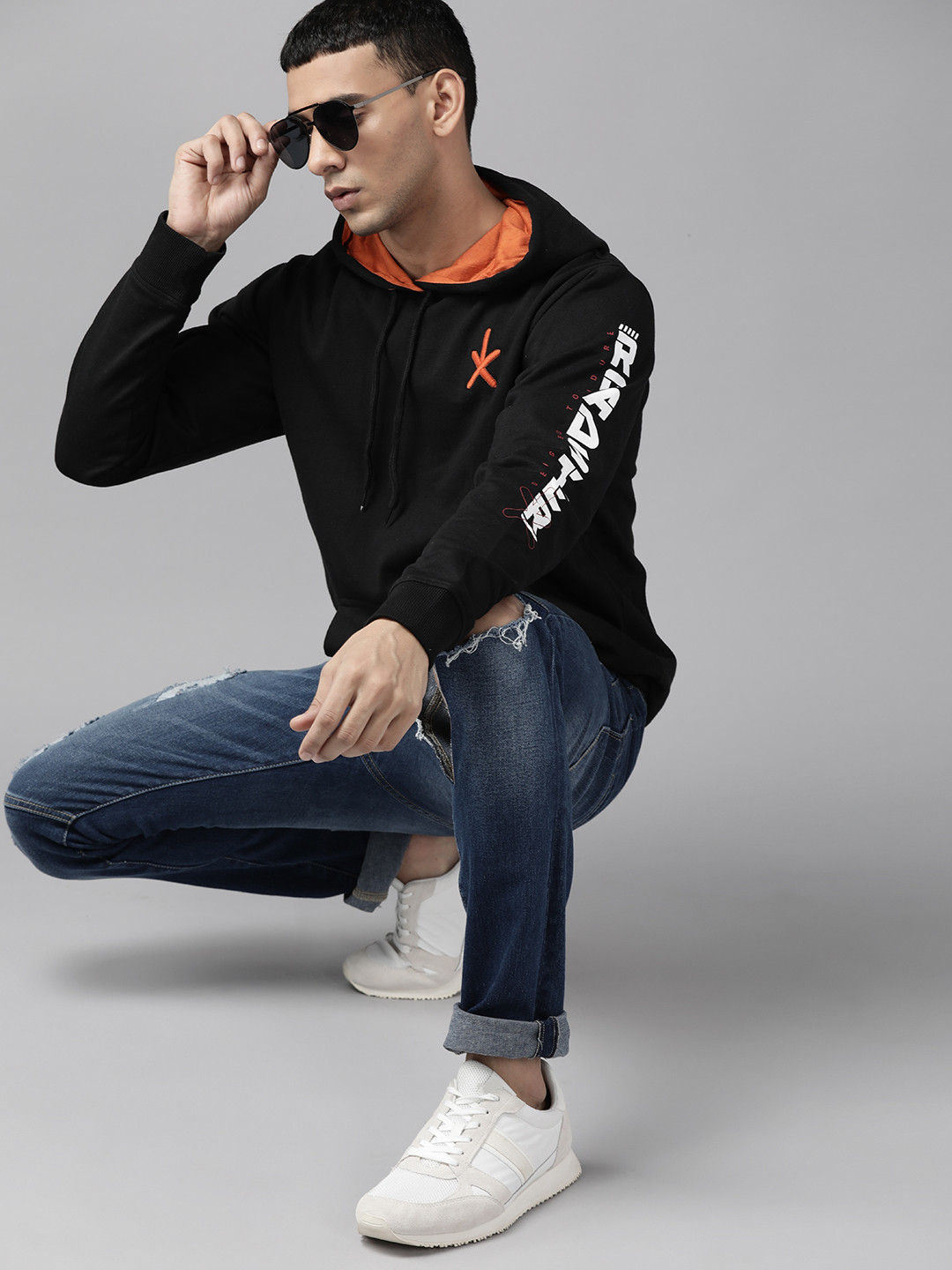 

The Roadster Lifestyle Co. Men Black Solid Hooded Sweatshirt