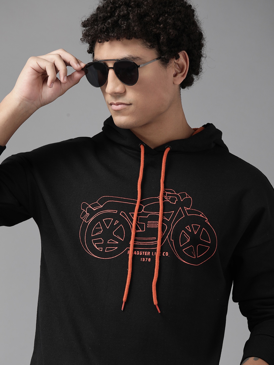 

The Roadster Lifestyle Co. Men Black & Orange Printed Hooded Sweatshirt