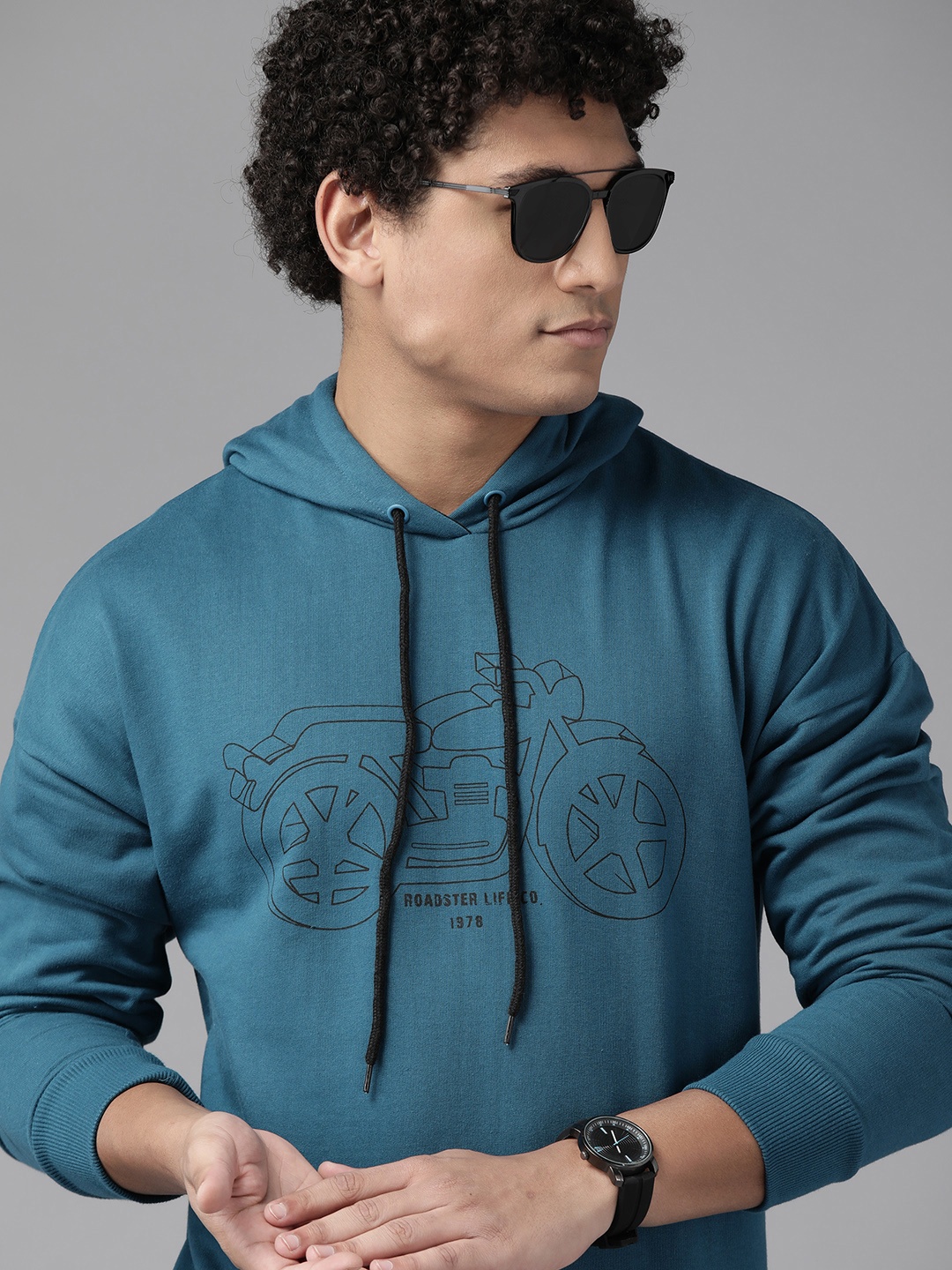 

The Roadster Lifestyle Co. Men Teal Green Printed Hooded Sweatshirt