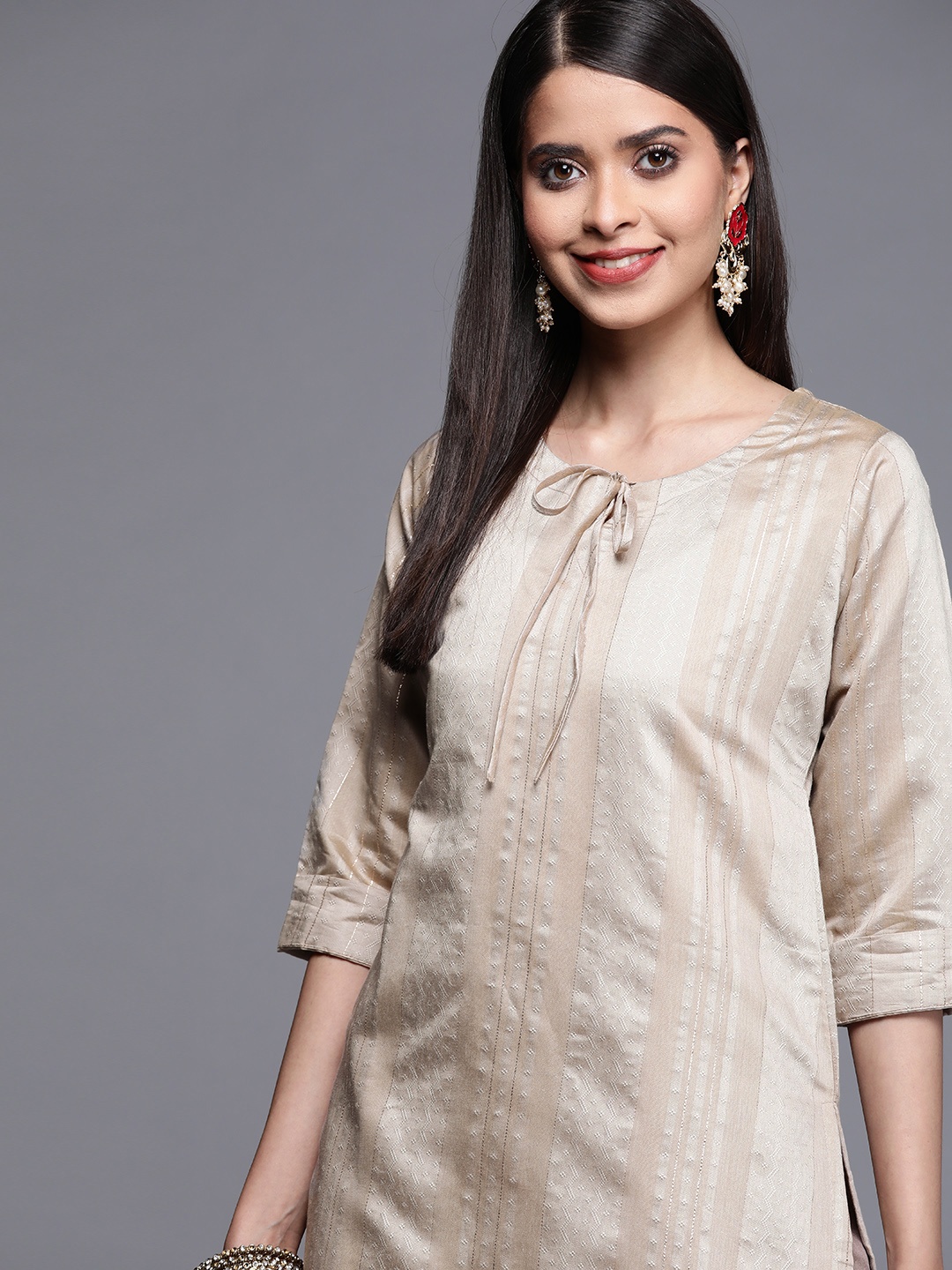 

Libas Women Beige & Silver Tie-Up Neck Woven Design Straight Kurta