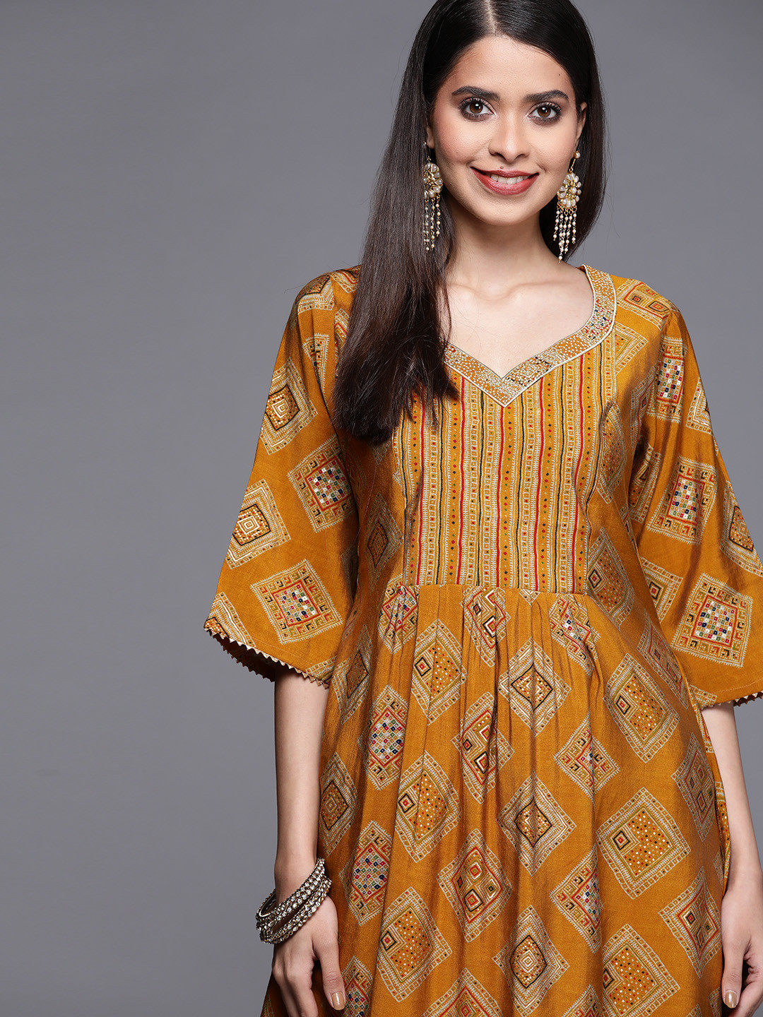

Libas Women Yellow Geometric Printed Flared Sleeves Chanderi Silk Kurta