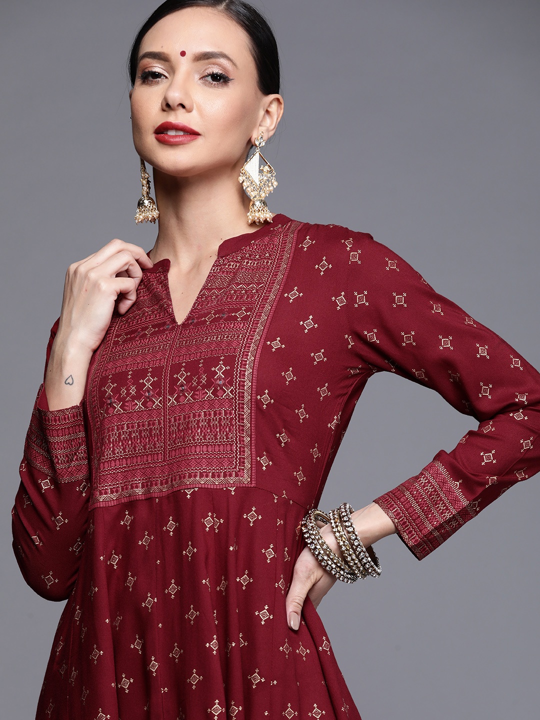 

Libas Women Maroon & Golden Mirror Work Yoke Ethnic Printed Panelled Anarkali Kurta