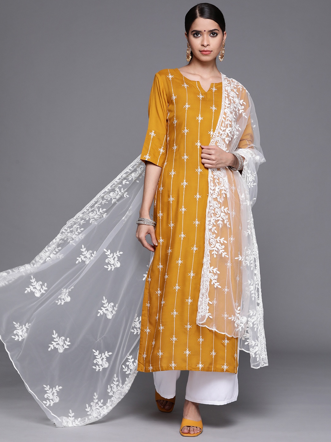 

Libas Women Yellow Regular Kurta with Palazzos & With Dupatta