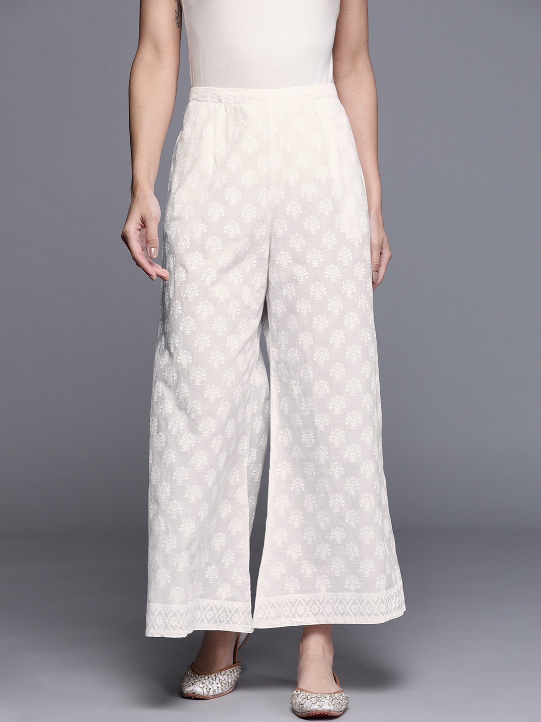 

Libas Women Cream-Coloured Self Design Flared Knitted Ethnic Palazzos