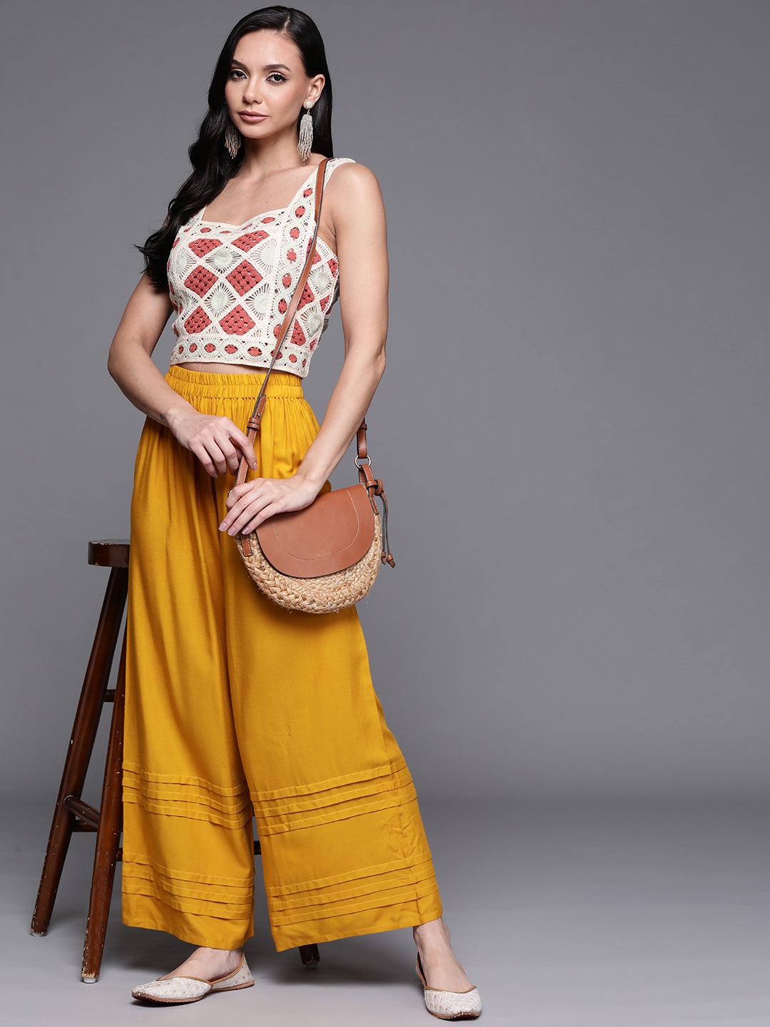 

Libas Women Mustard Yellow Pleated Detail Flared Palazzos