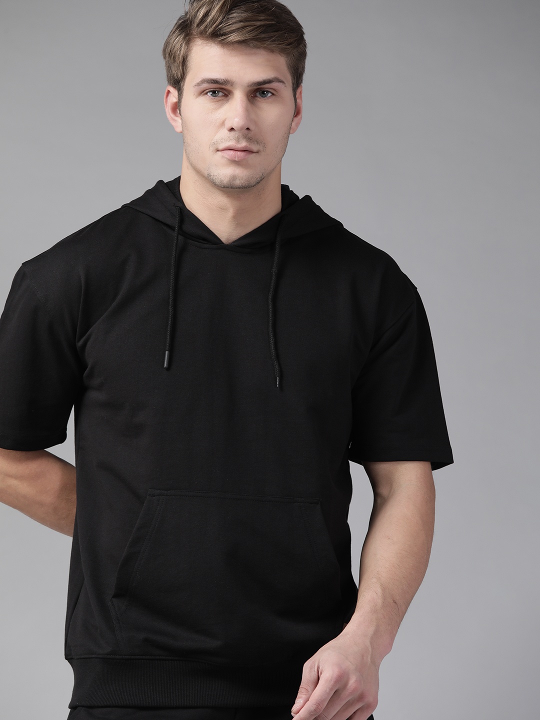 

The Roadster Lifestyle Co Men Black Solid Hooded Sweatshirt