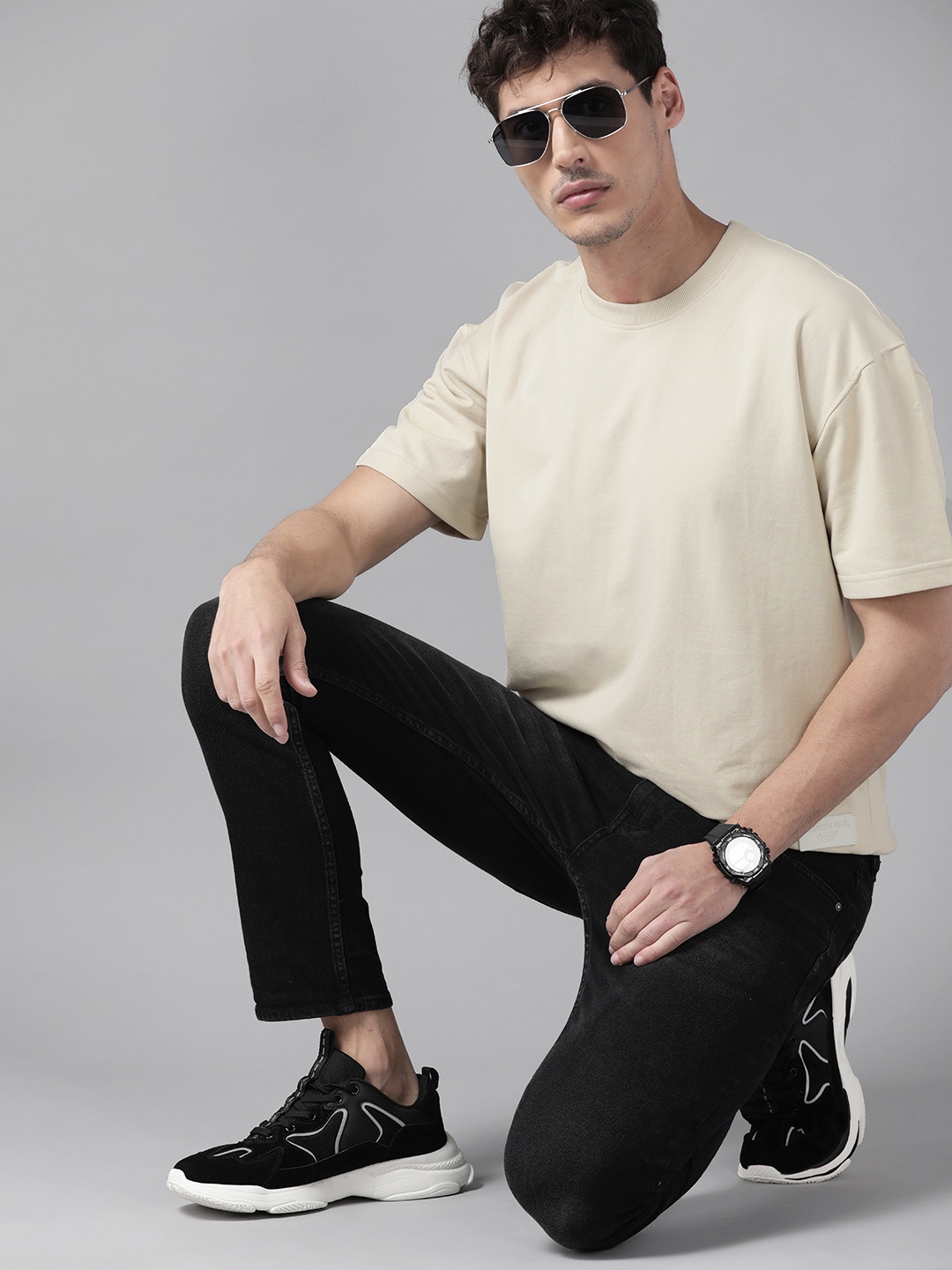 

The Roadster Lifestyle Co Men Cream-Coloured Solid Sweatshirt