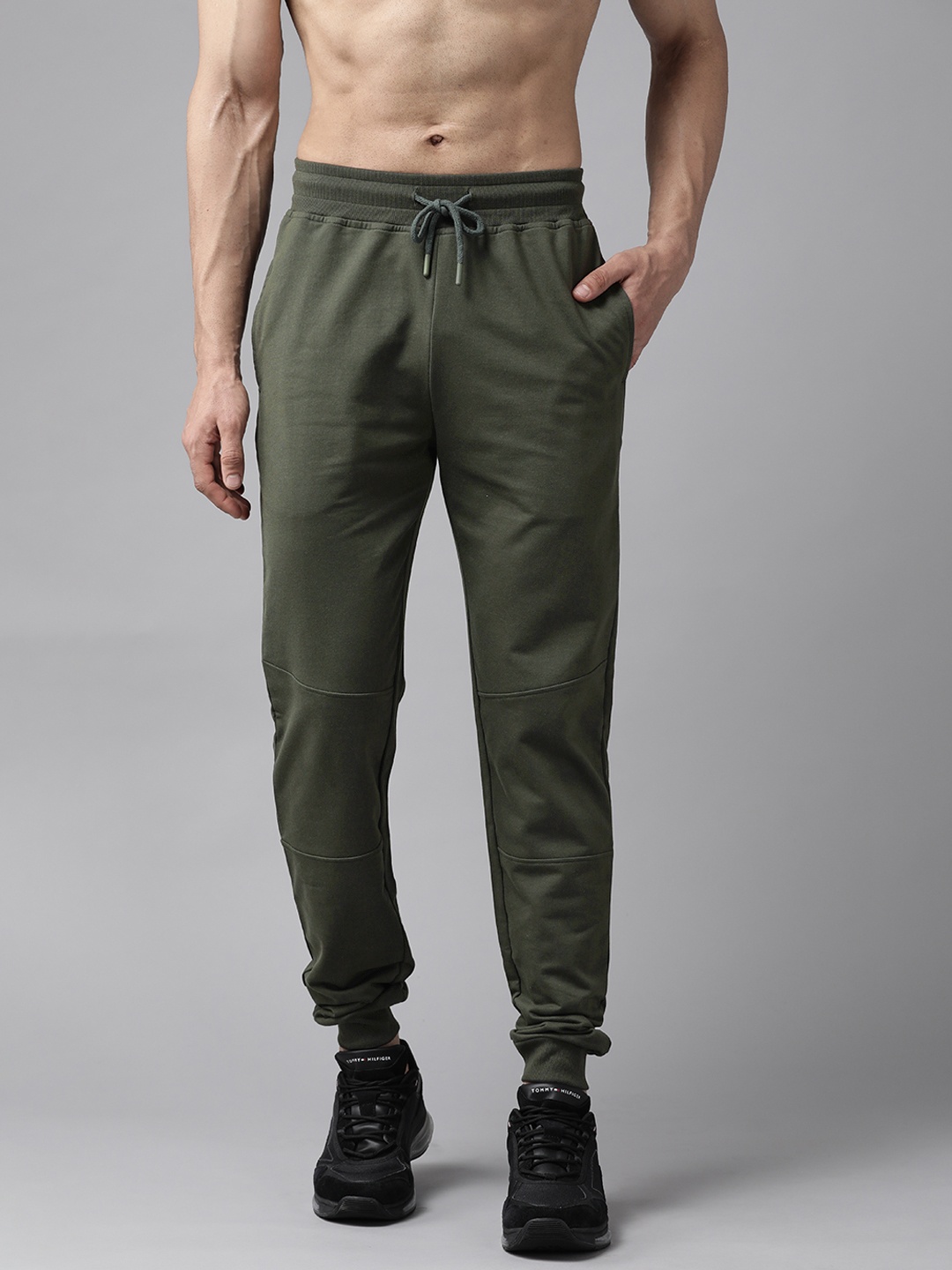 

The Roadster Lifestyle Co Men Olive Green Solid Knitted Relaxed Fit Joggers