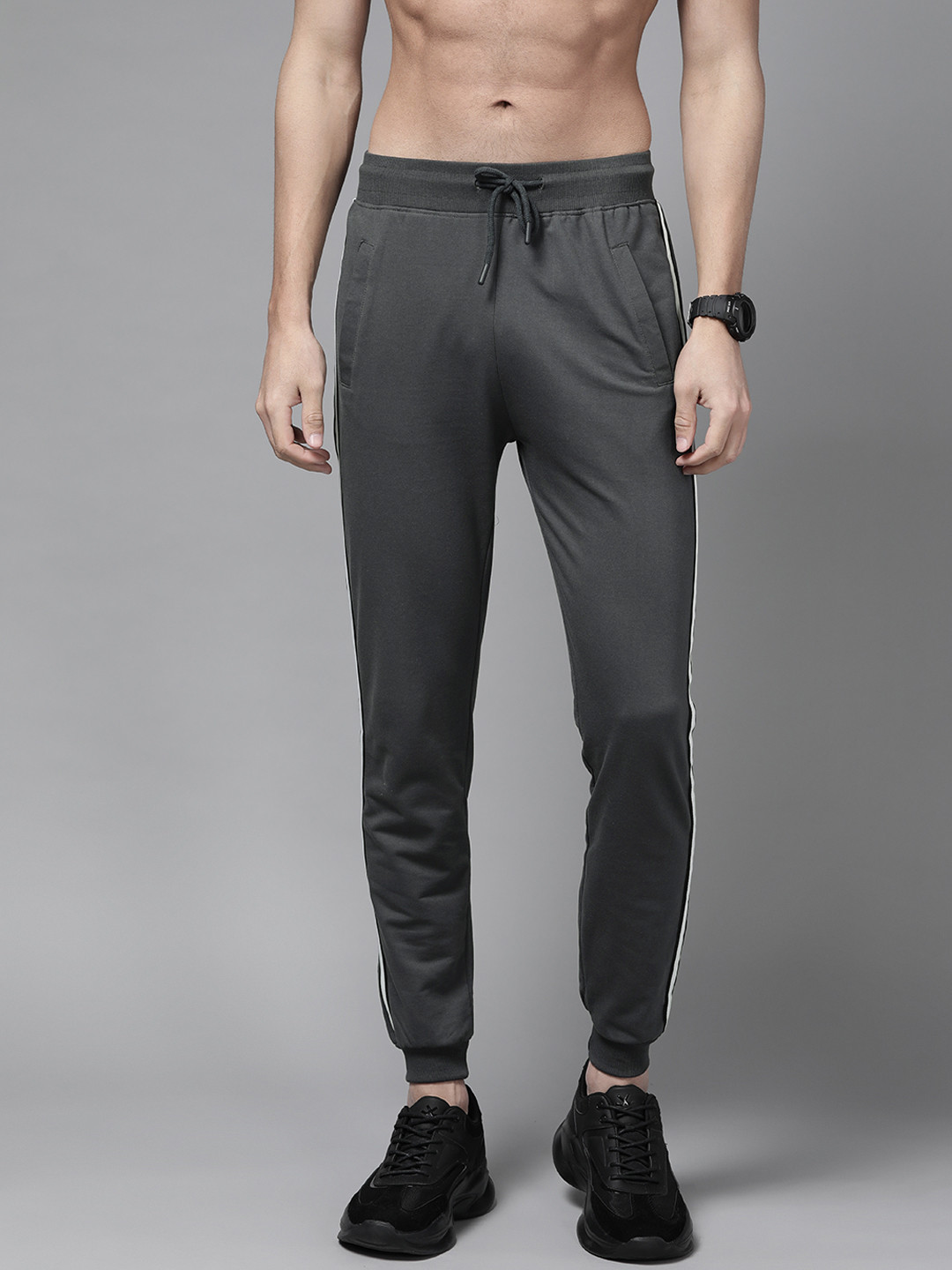 

The Roadster Lifestyle Co Men Charcoal Grey Solid Joggers