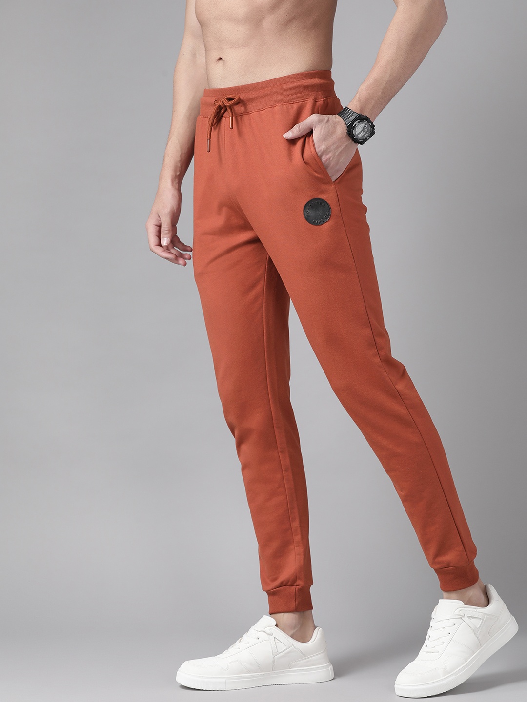 

The Roadster Lifestyle Co Men Rust Orange Solid Joggers