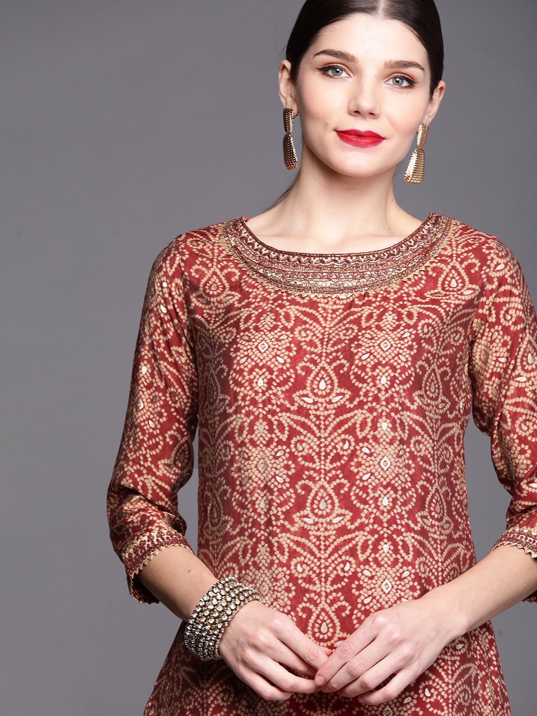 

Inddus Women Maroon Bandhani Printed Regular Zardozi Kurta with Trousers