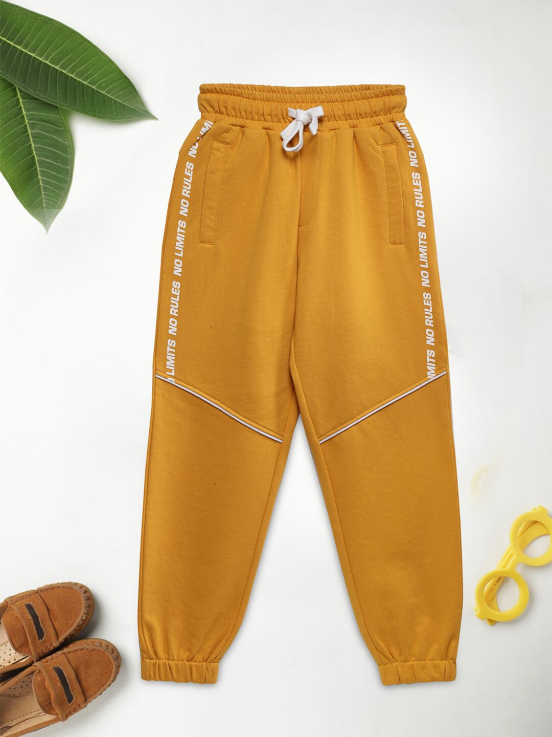 

Lil Tomatoes Boys Mustard Yellow & White Solid Pure Cotton Joggers